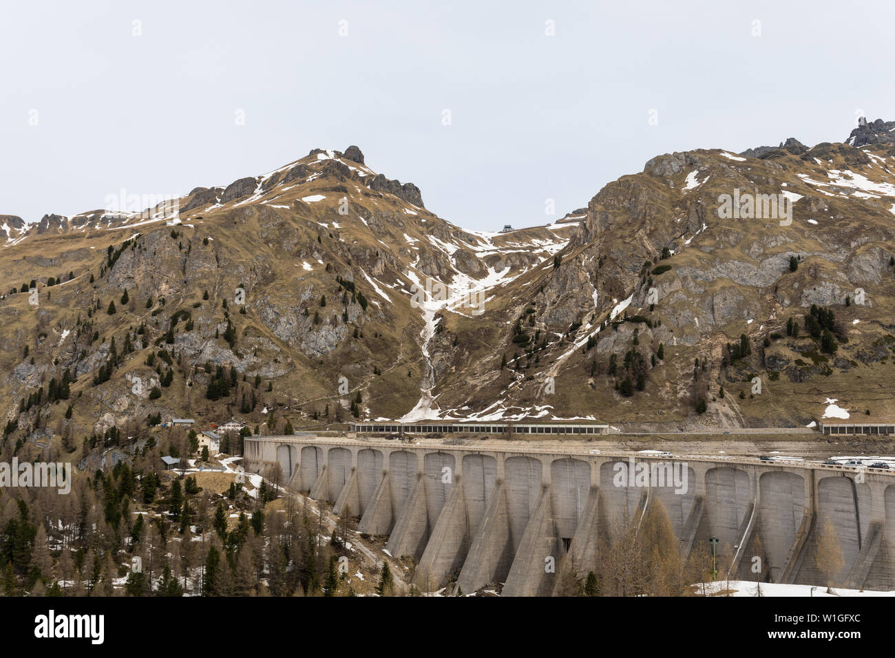 Dam at the Fedaia Lake (Lago di Fedaia) in the Dolomites,Italy Stock Photo