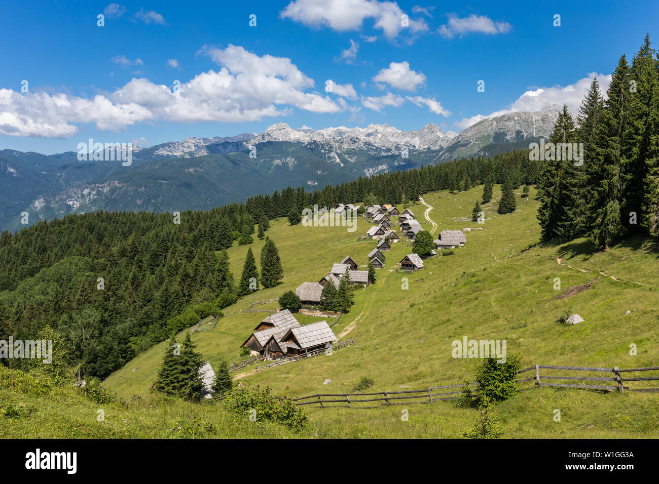 Idyllic shepherds' cottages on Zajamniki meadow in Slovenia Stock Photo