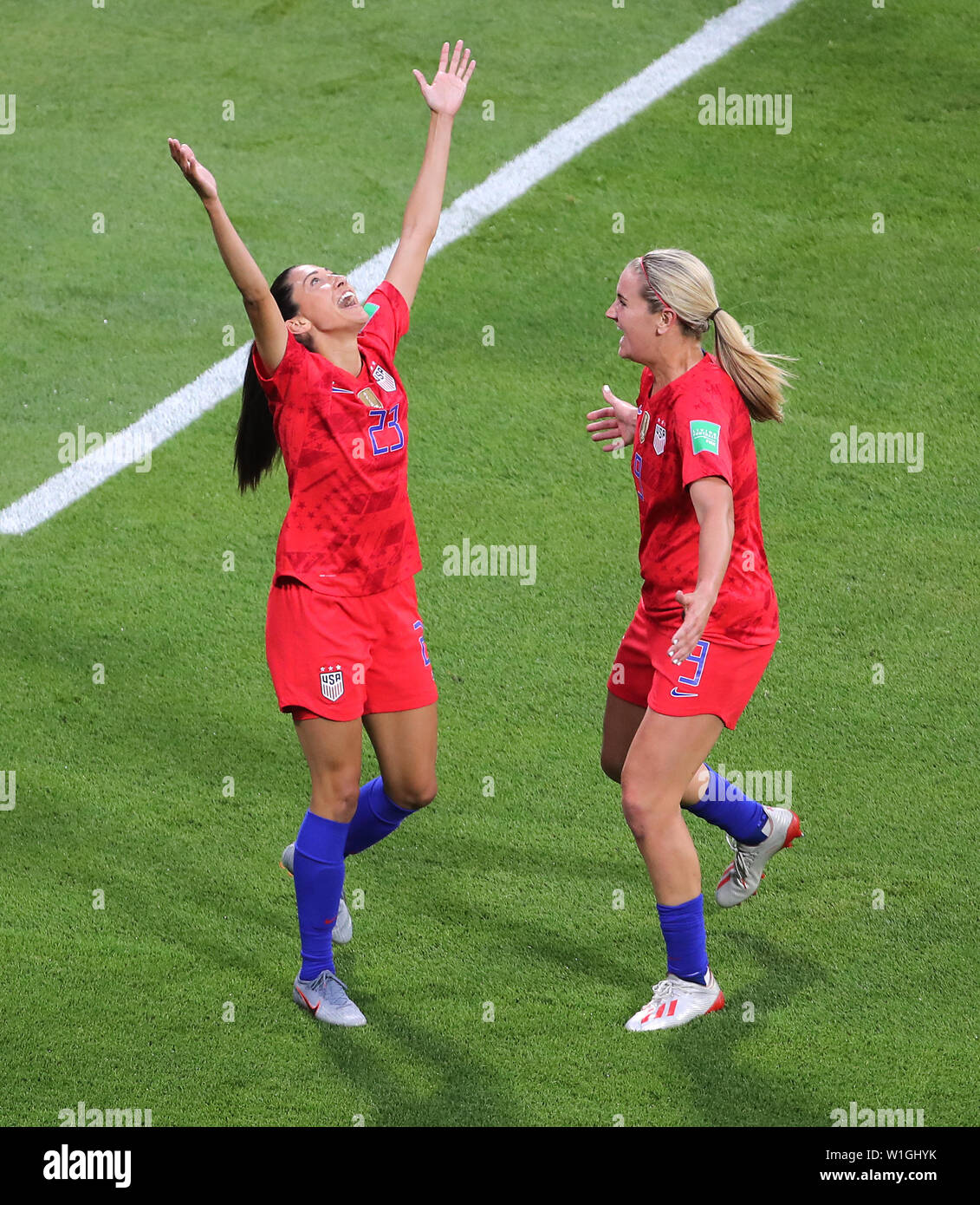 USA's Christen Press (left) celebrates scoring her side's first goal of the  game with team mate Lindsey Horan (right) during the FIFA Women's World Cup  Semi Final match at the Stade de