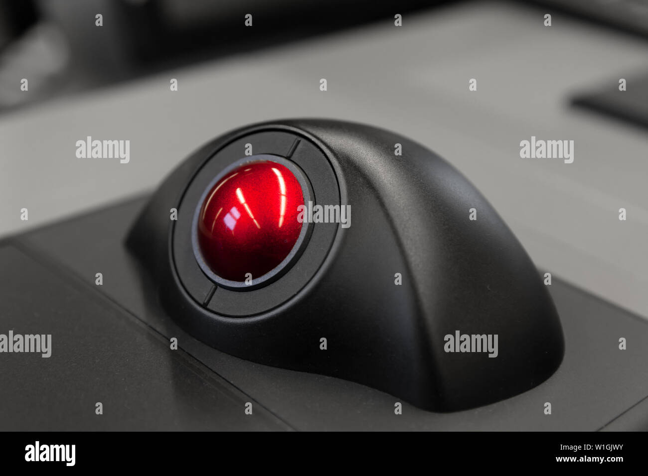 Industrial control panel with red trackball, close up photo with soft selective focus Stock Photo