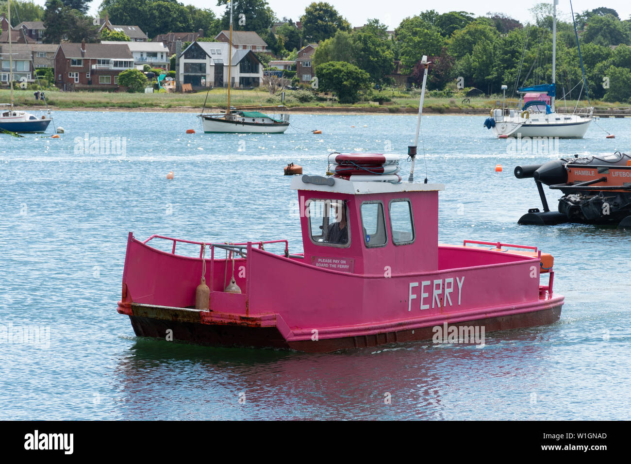 The pink ferry on the River Hamble which transports passengers between Hamble (Hamble-le-Rice) and Warsash, Hampshire, UK Stock Photo