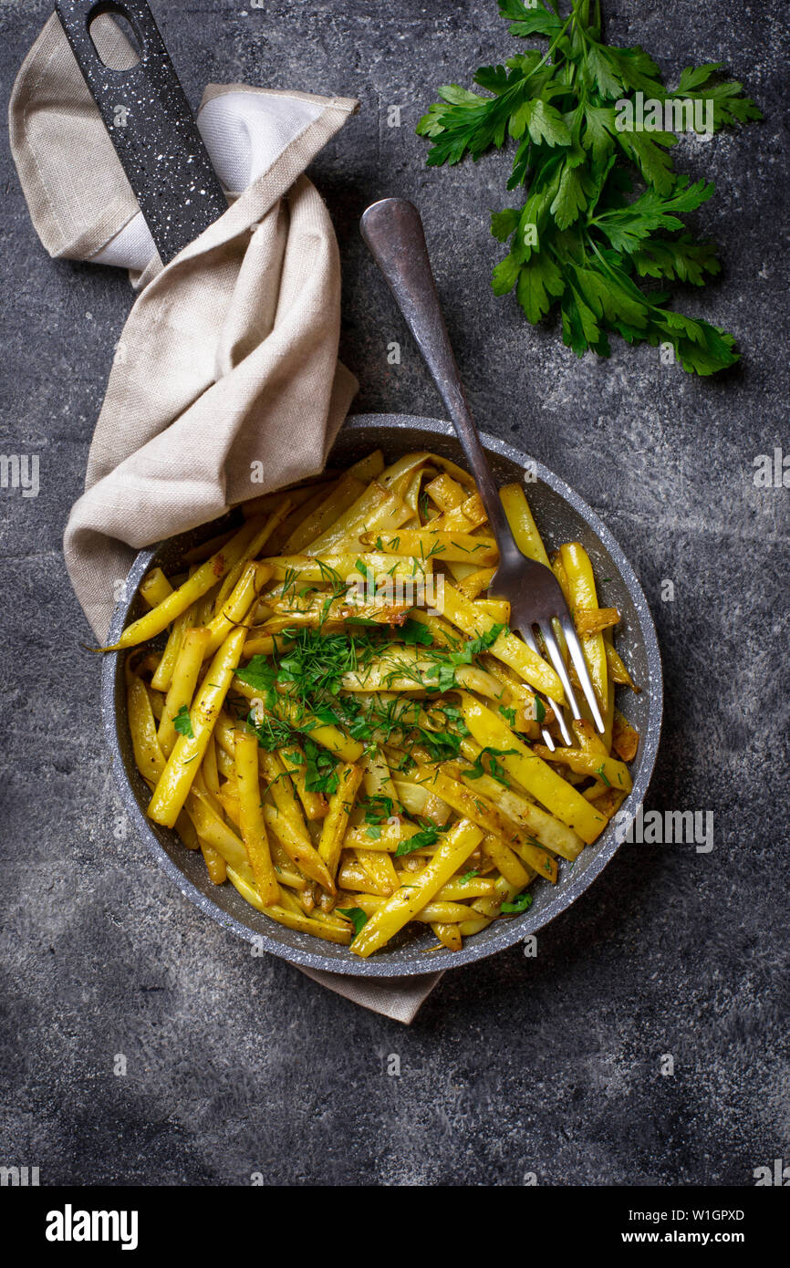 Stewed yellow wax beans in pan Stock Photo