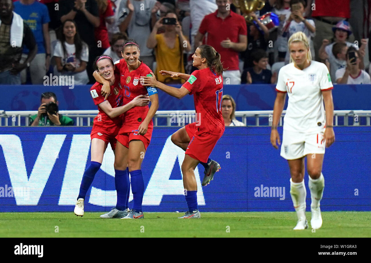 USA's Alex Morgan (centre) celebrates scoring her side's second goal of the game with team-mates as England's Rachel Daly (right) appears dejected during the FIFA Women's World Cup Semi Final match at the Stade de Lyon. Stock Photo