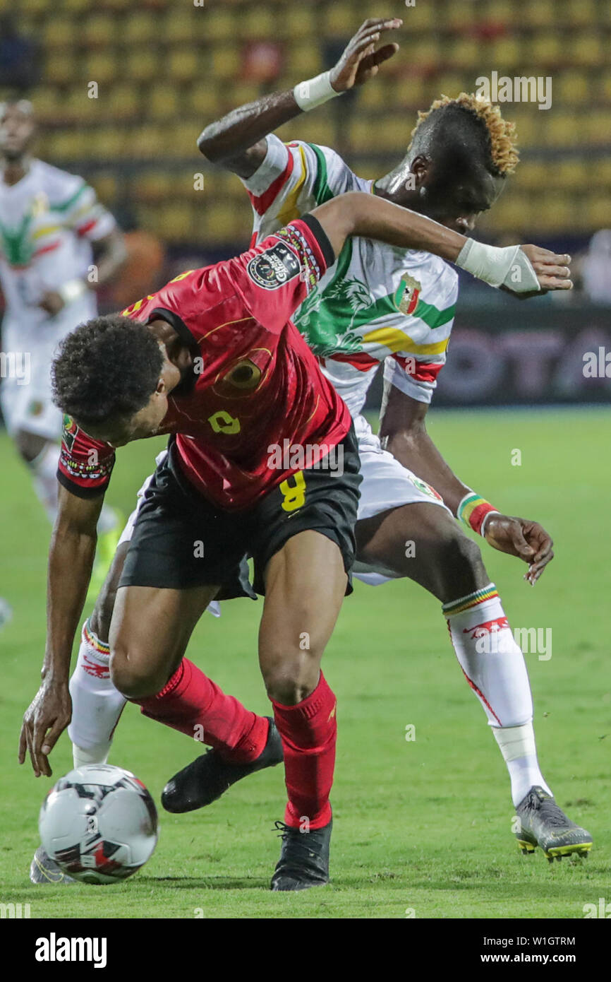 Ismailia, Egypt. 02nd July, 2019. Mali's Falaye Sacko (R) battles for the ball with Angola's Fredy during the 2019 Africa Cup of Nations Group E soccer match between Angola and Mali at the Imailia Stadium. Credit: Gehad Hamdy/dpa/Alamy Live News Stock Photo