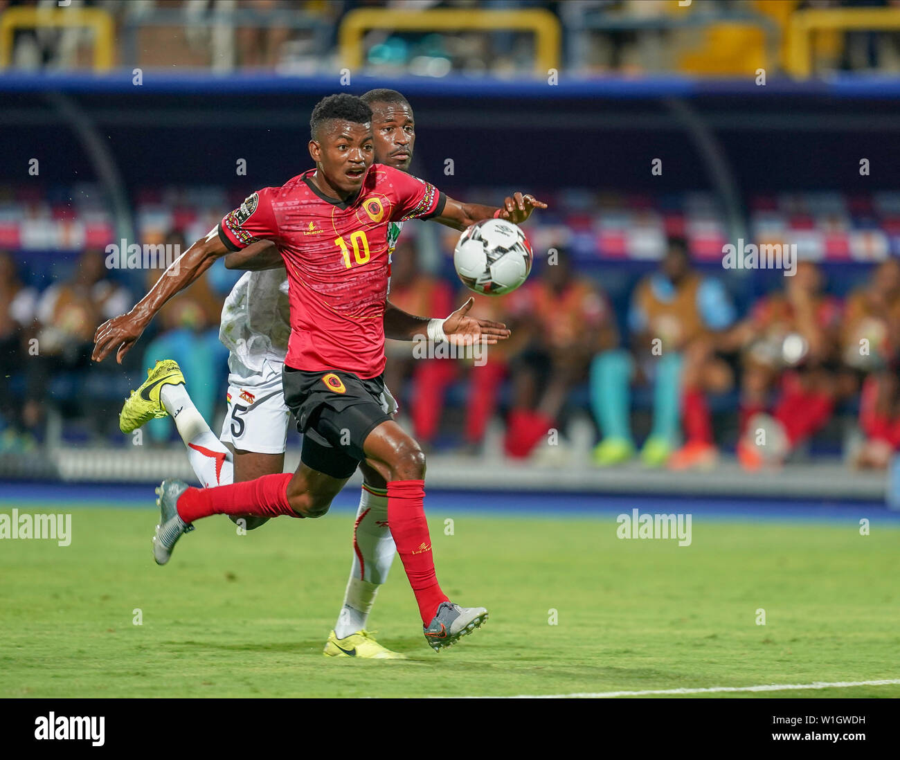 Ismailia, Egypt. 2nd July, 2019. Jacinto Muondo Dala of Angola and Boubacar Kiki Kouyate of Mali challenging for the ball during the 2019 African Cup of Nations match between Angola and Mali at the Ismailia Stadium in Ismailia, Egypt. Ulrik Pedersen/CSM/Alamy Live News Stock Photo