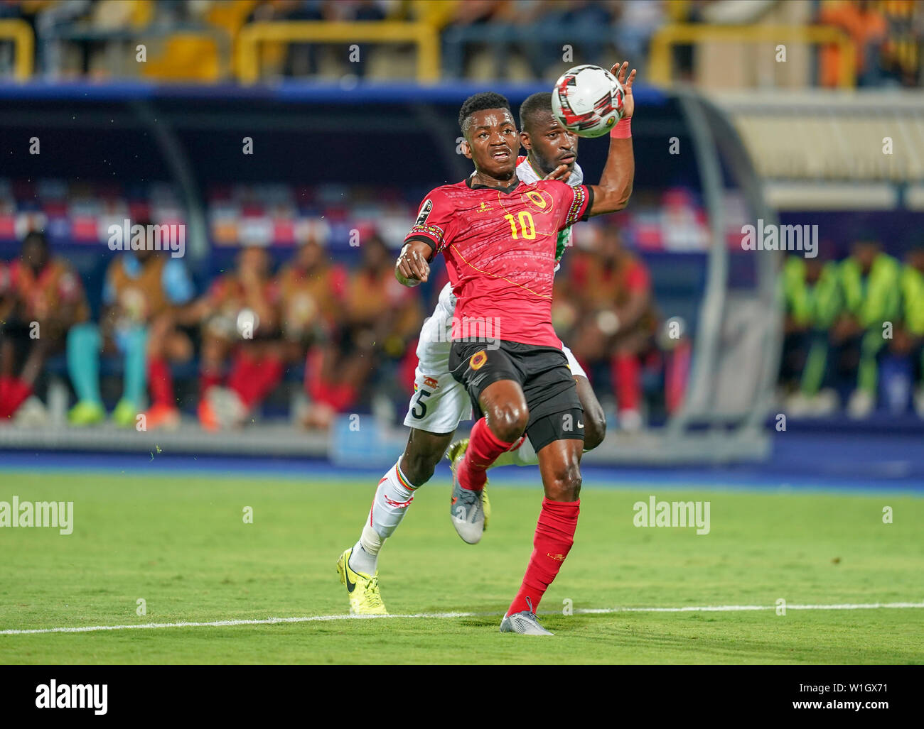 Ismailia, Egypt. 2nd July, 2019. Jacinto Muondo Dala of Angola and Boubacar Kiki Kouyate of Mali challenging for the ball during the 2019 African Cup of Nations match between Angola and Mali at the Ismailia Stadium in Ismailia, Egypt. Ulrik Pedersen/CSM/Alamy Live News Stock Photo