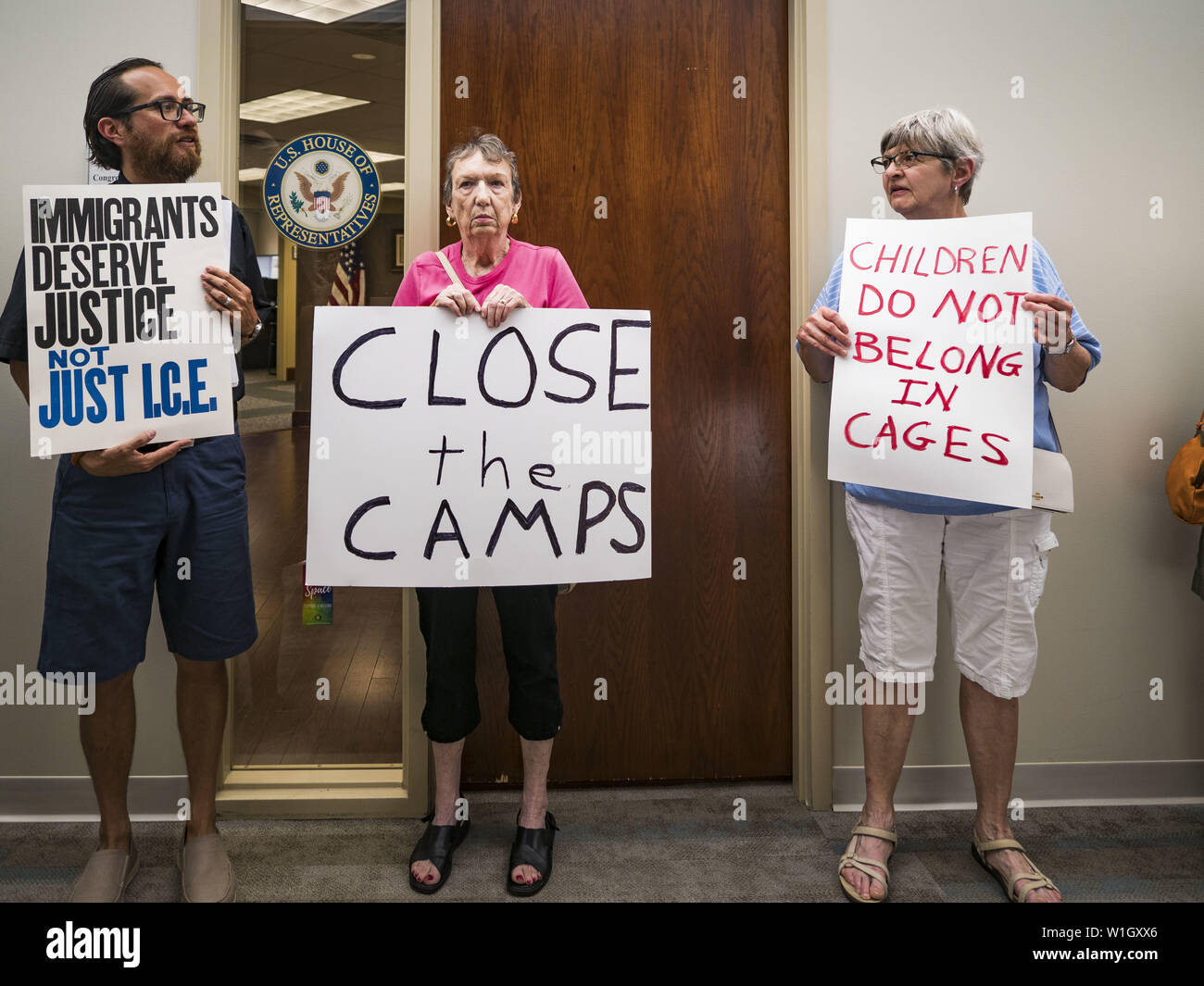 July 2, 2019 - Des Moines, Iowa, U.S - Protesters stand in front of the door to the office of Rep. Cindy Axne (D-IA). About 150 people came to Congresswoman Axne's office in Des Moines Tuesday to protest the treatment of migrant children detained by the US Border Patrol along the US/Mexico border. Axne was not in the office, but a member of Axne's staff took notes and promised to pass people's concerns on to the Congresswoman. Similar protests were held at other congressional offices and Immigration and Customs Enforcement (ICE) detention facilities across the country. (Credit Image: © Jack Ku Stock Photo