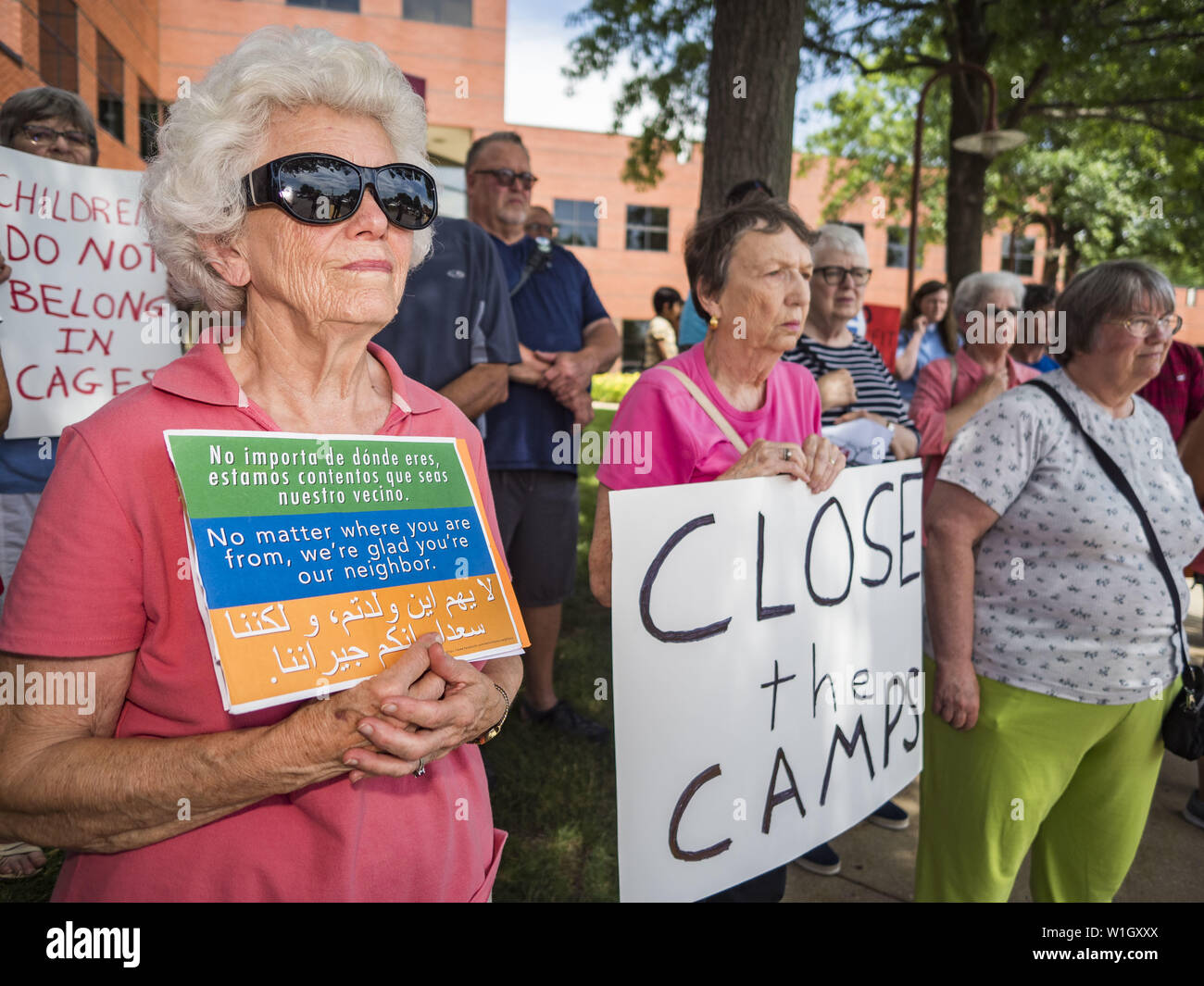 July 2, 2019 - Des Moines, Iowa, U.S - People gather outside of Rep. Cindy Axne's (D-IA) office in Des Moines. About 150 people came to Congresswoman Axne's office Tuesday to protest the treatment of migrant children detained by the US Border Patrol along the US/Mexico border. Axne was not in the office, but a member of Axne's staff took notes and promised to pass people's concerns on to the Congresswoman. Similar protests were held at other congressional offices and Immigration and Customs Enforcement (ICE) detention facilities across the country. (Credit Image: © Jack Kurtz/ZUMA Wire) Stock Photo