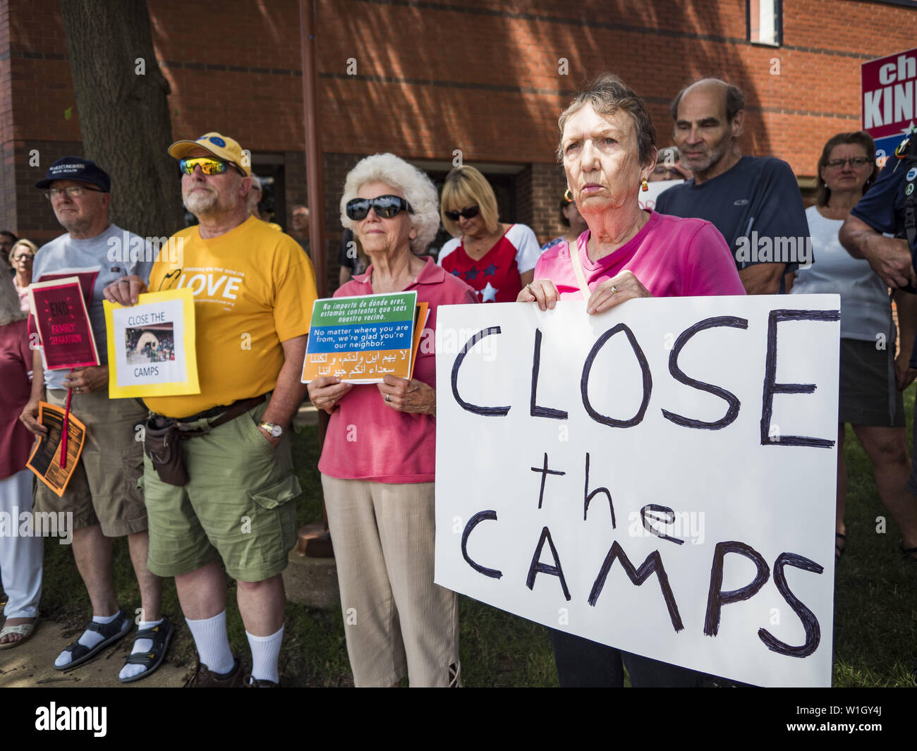 July 2, 2019 - Des Moines, Iowa, U.S - People gather outside of Rep. Cindy Axne's (D-IA) office in Des Moines. About 150 people came to Congresswoman Axne's office Tuesday to protest the treatment of migrant children detained by the US Border Patrol along the US/Mexico border. Axne was not in the office, but a member of Axne's staff took notes and promised to pass people's concerns on to the Congresswoman. Similar protests were held at other congressional offices and Immigration and Customs Enforcement (ICE) detention facilities across the country. (Credit Image: © Jack Kurtz/ZUMA Wire) Stock Photo