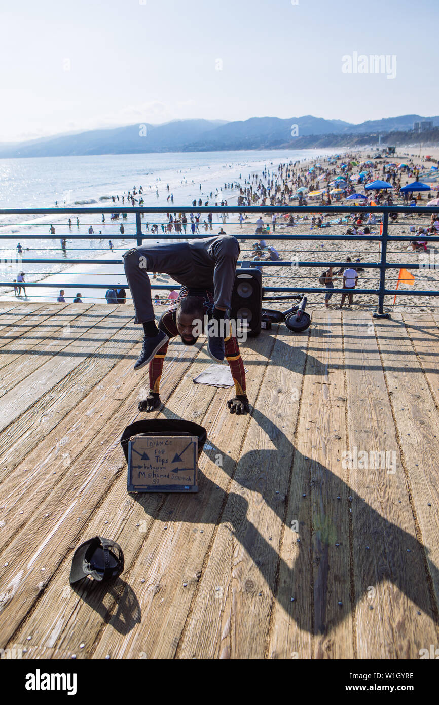 Contorsionist artist performing on Santa Monica Pier, Los Angeles, California Stock Photo