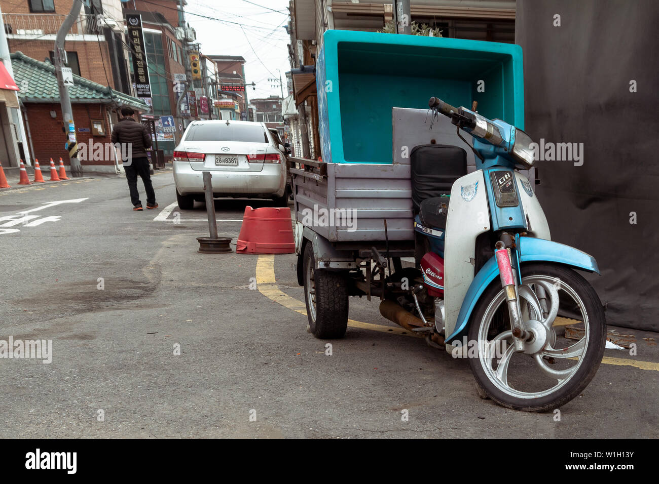 Seoul, South Korea 18.03.18 moped with a trailer on the street in