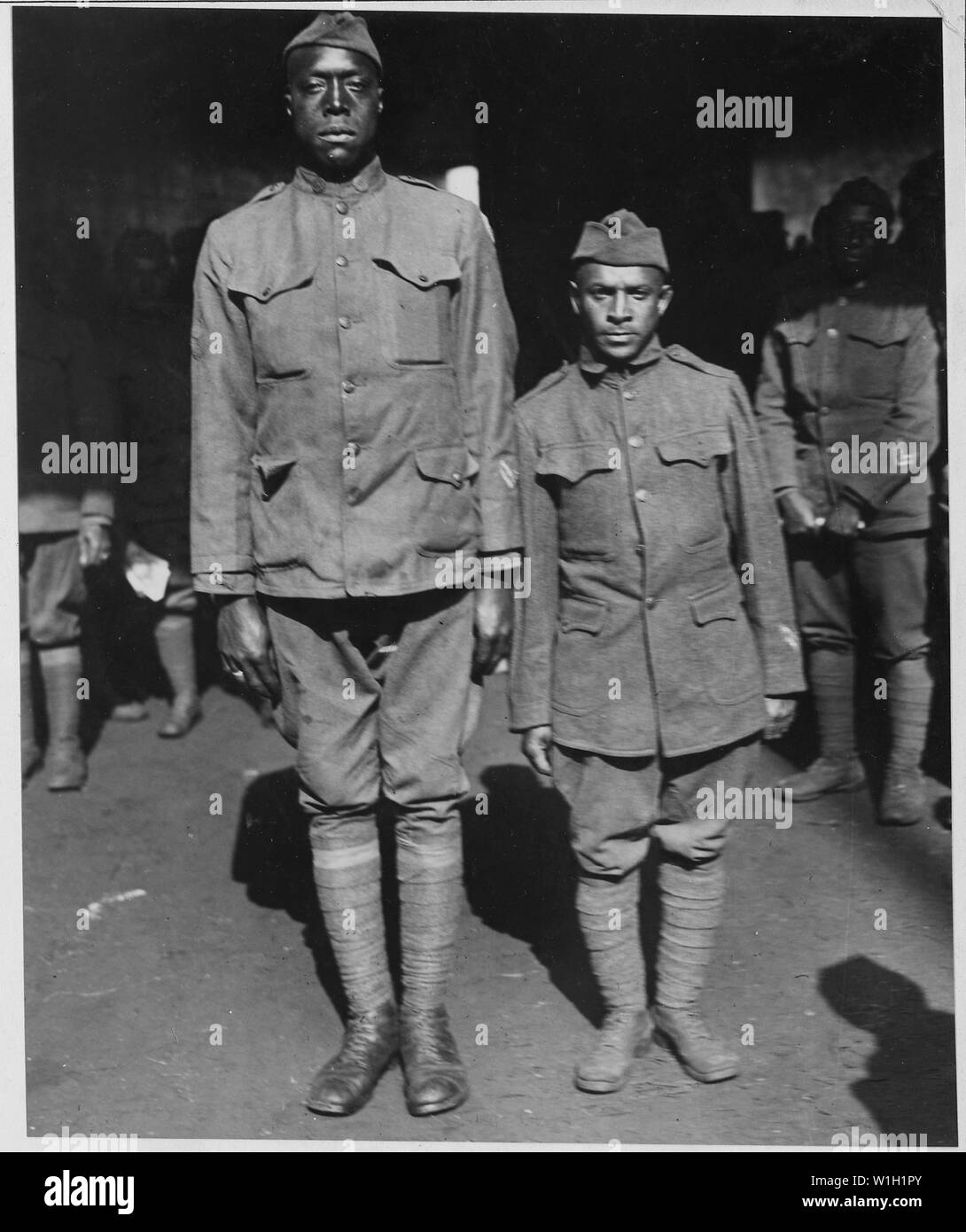 Mutt and Jeff of Company D, 505th Engineers on the Roma. The tallest and shortest members o . . .; Scope and content:  The full caption for this item is as follows: Mutt and Jeff of Company D, 505th Engineers on the Roma. The tallest and shortest members of the 505th [African American] Engineers that returned on the S.S. Roma. The tall one is Jesse Hixon of Pittsburg [Pennslyvania] and the short one Thomas C. Crispell of New Kingston, Pennslyvania. Stock Photo