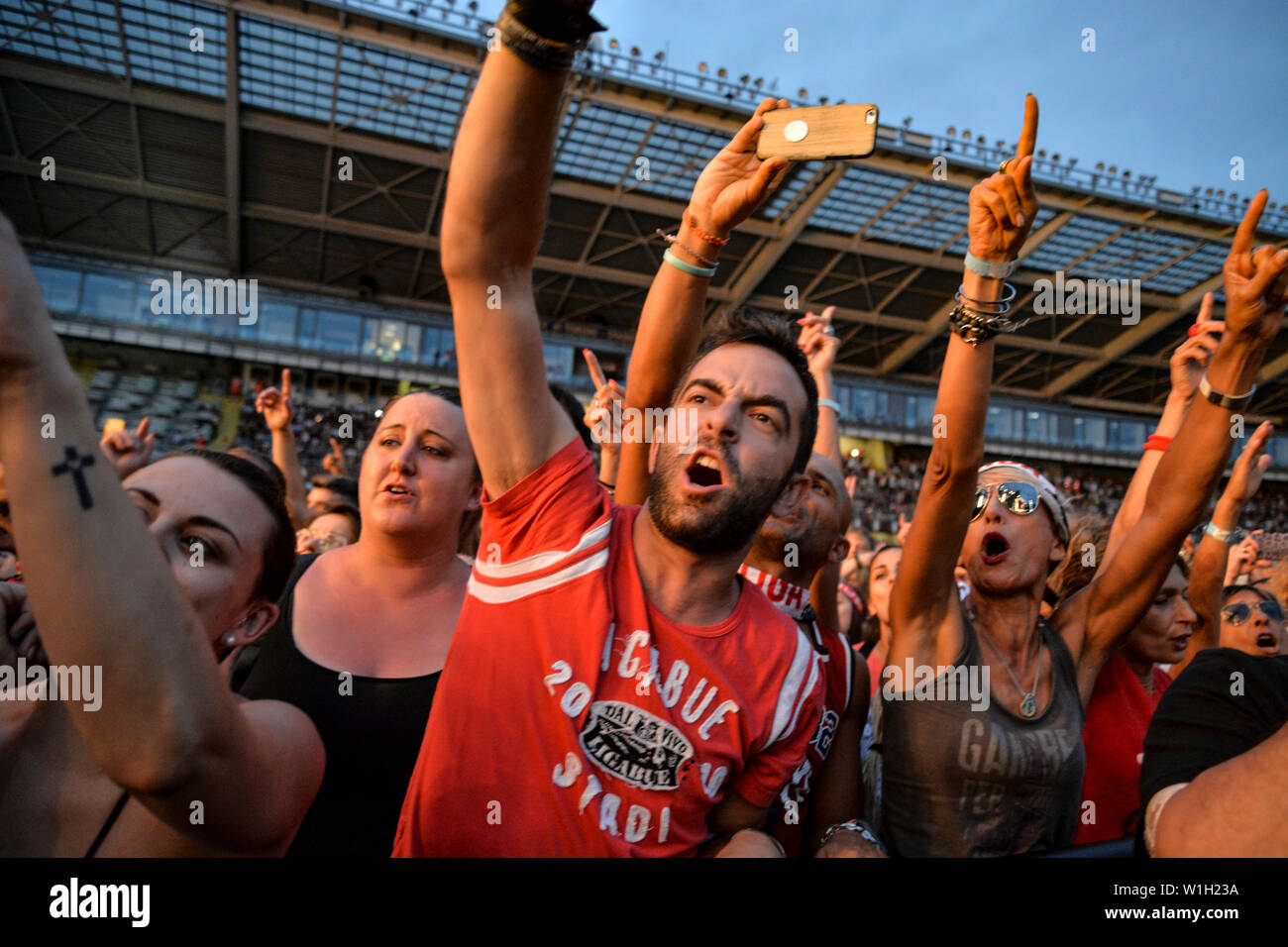 Fans cheer for Luciano Ligabue performing live on stage at the Stadio Olimpico Grande Torino in Turin for the “Start Tour 2019”. Stock Photo