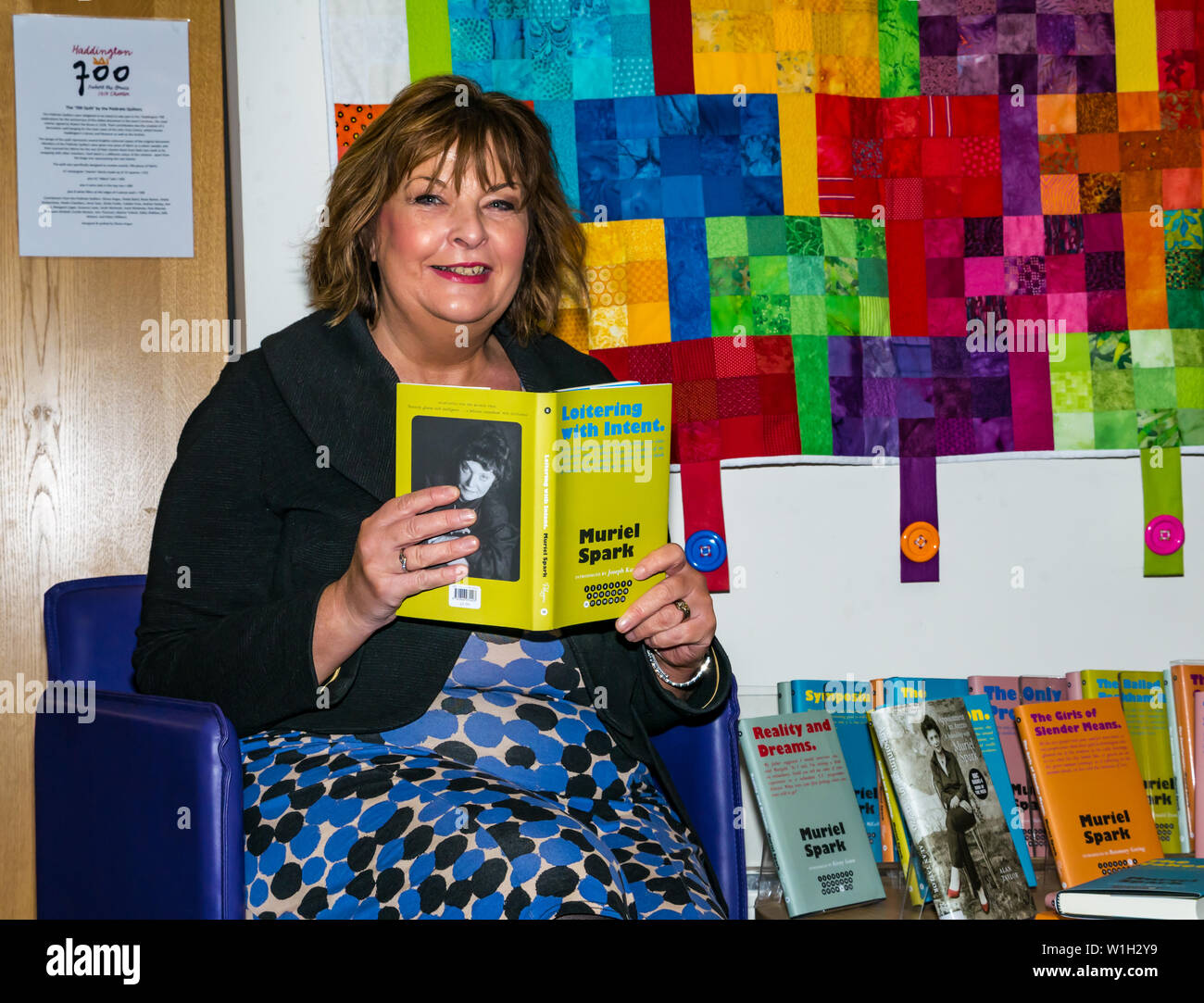 Fiona  Hyslop, Scottish Government Minister visits John Gray Centre, holding Muriel Spark book, Haddington, East Lothian, Scotland, UK Stock Photo
