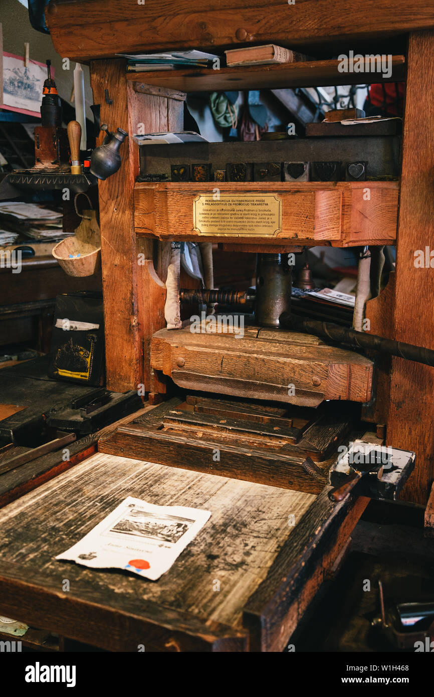 Bled, Slovenia - September, 8 2018: Close up of ancient wooden reconstructed Gutenberg's printing machine used now for making printed by tourists souv Stock Photo