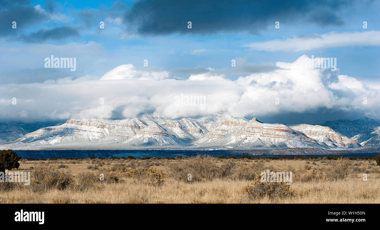 Clouds dance over a snow covered ridgeline off US 6 near East Carbon, Utah, between Green River and Price, Utah. (c) 2012 Tom Kelly Stock Photo