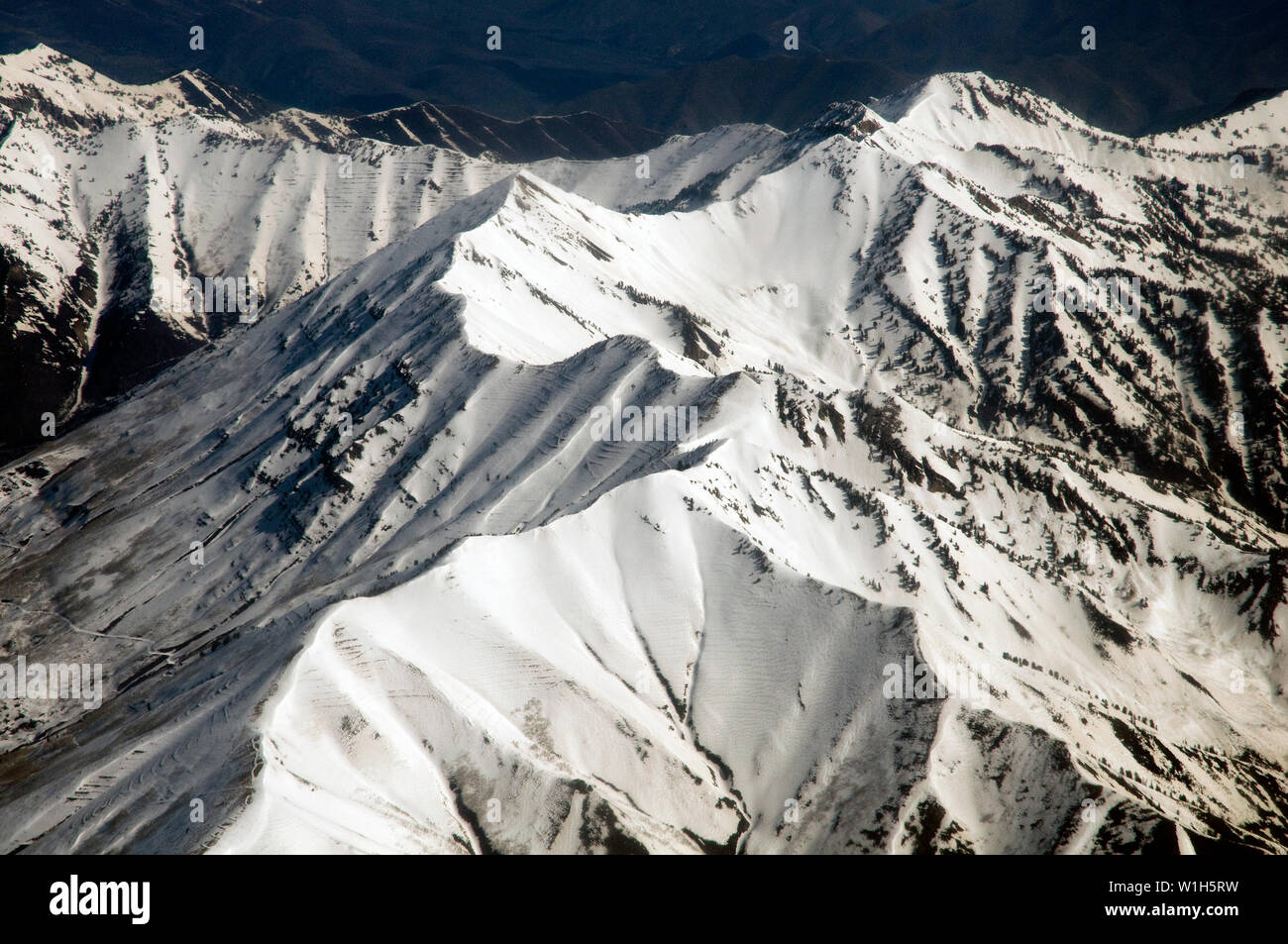 Snow covers the ridgelines of Squaw Peak on approach to Salt Lake City on a Sky West regional jet for Delta Air Lines. (c) 2010 Tom Kelly Stock Photo