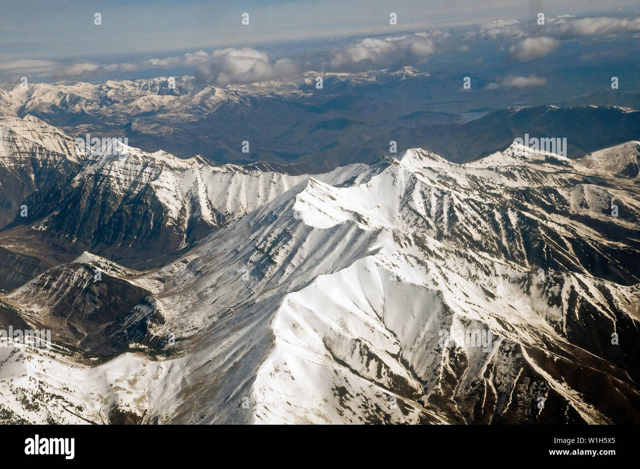 Snow blankets Squaw Peak near Provo, Utah on approach to Salt Lake City on a Sky West regional jet for Delta Air Lines. (c) 2010 Tom Kelly Stock Photo