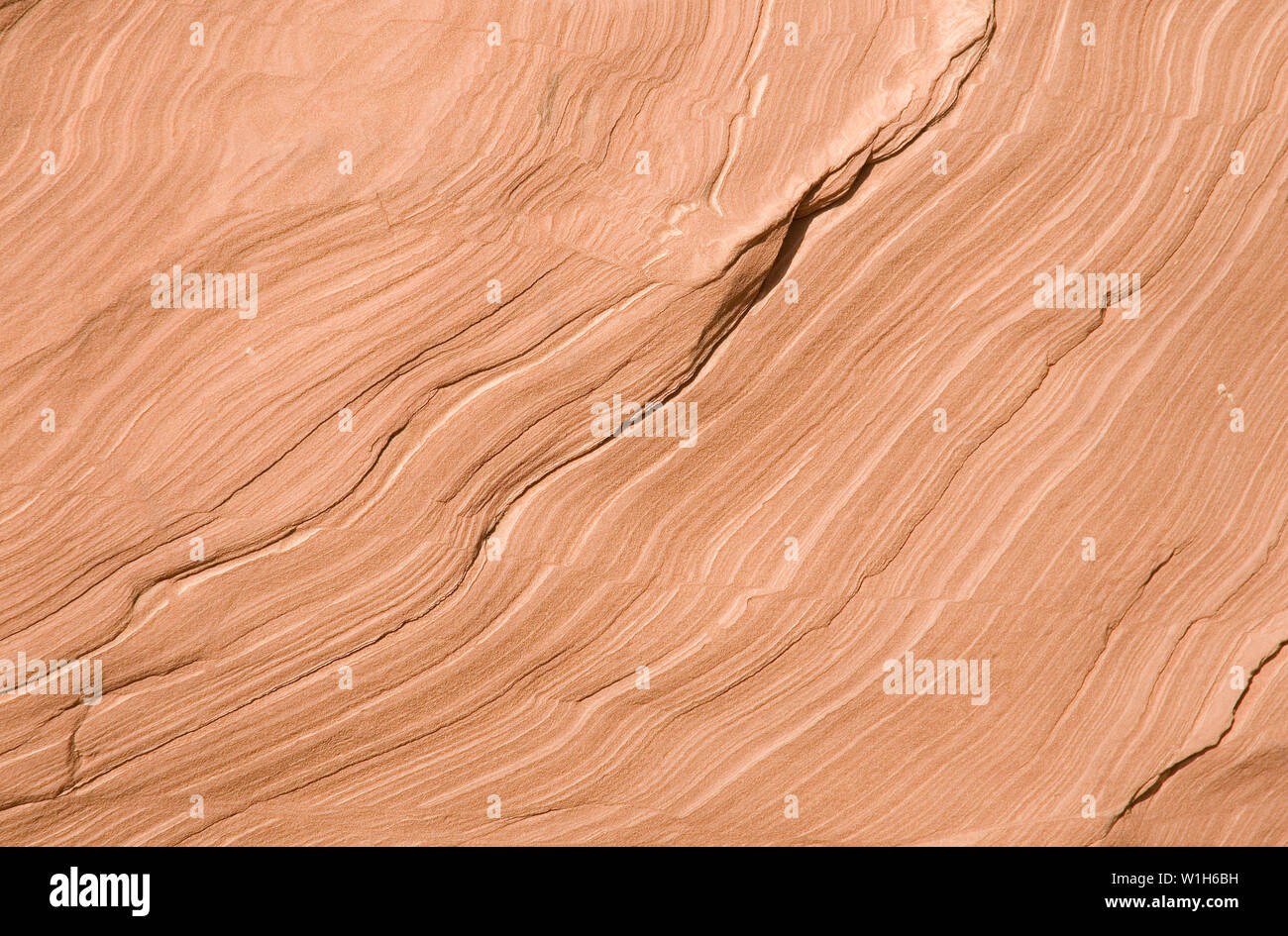 Tan sandstone walls show the striations of time in Moonshine Wash south of Green River, Utah in Robber's Roost country. Stock Photo