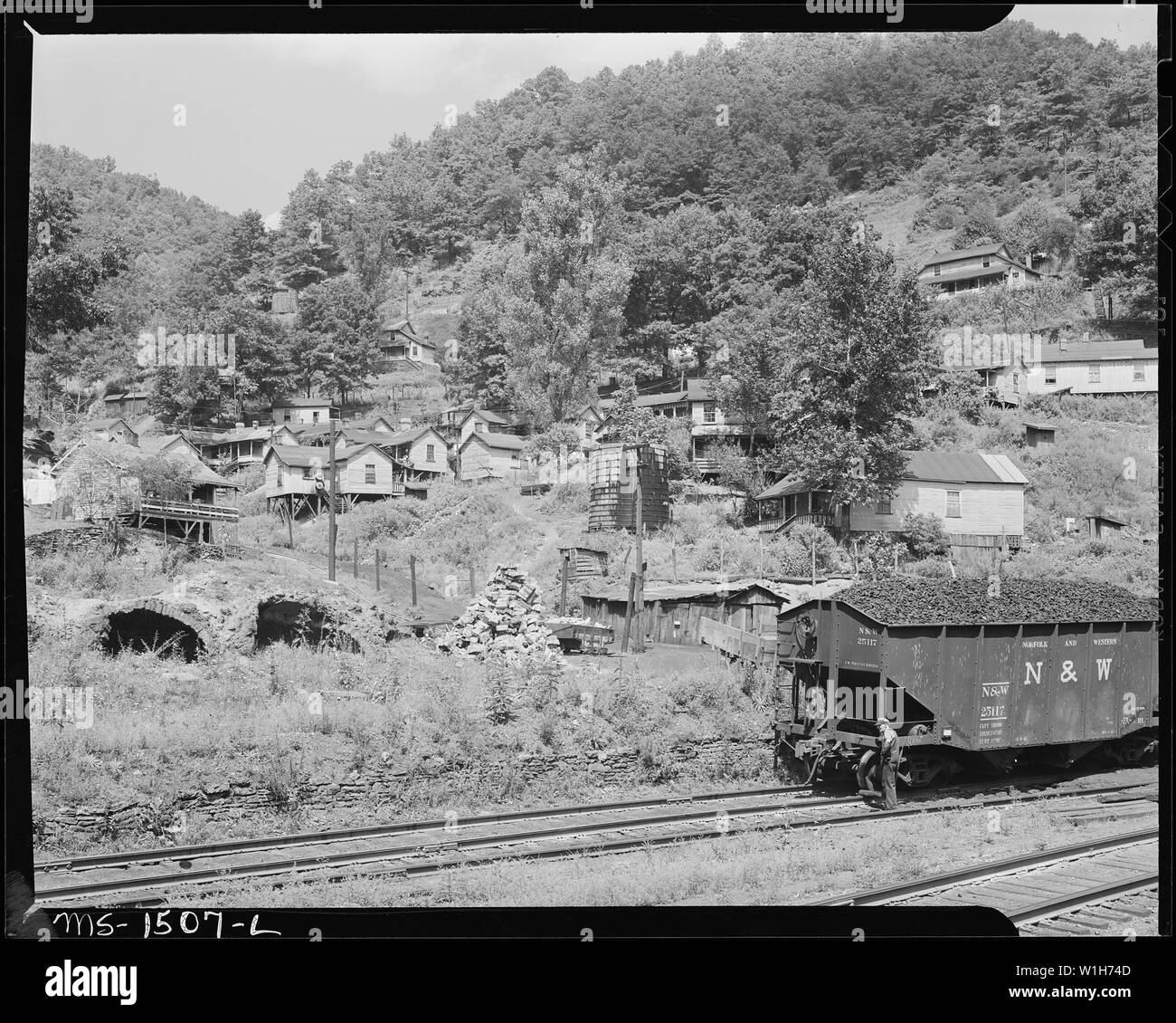 Negro housing, water tank and old beehive coke ovens. Gilliam Coal and