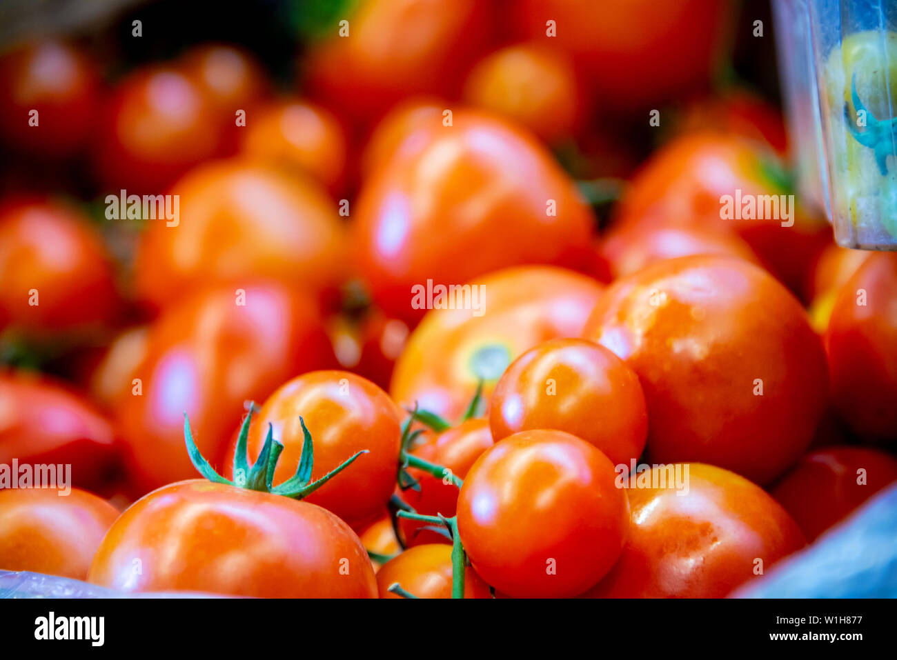 Tomatoes at the market display stall Stock Photo - Alamy