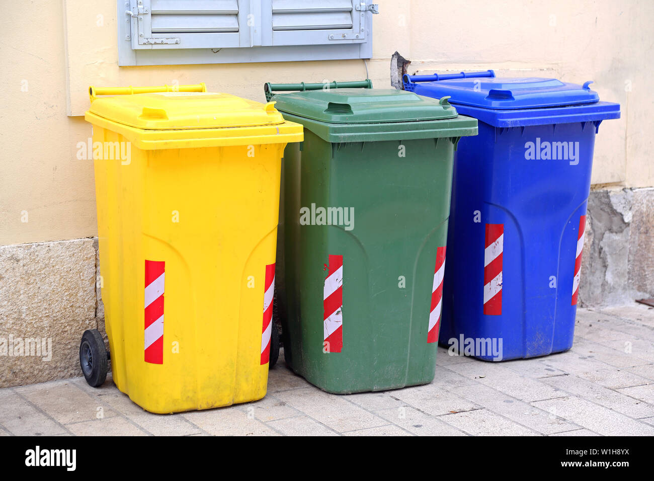 Three Recycling and Sorting Plastic Trash Wheelie Bins Stock Photo - Alamy