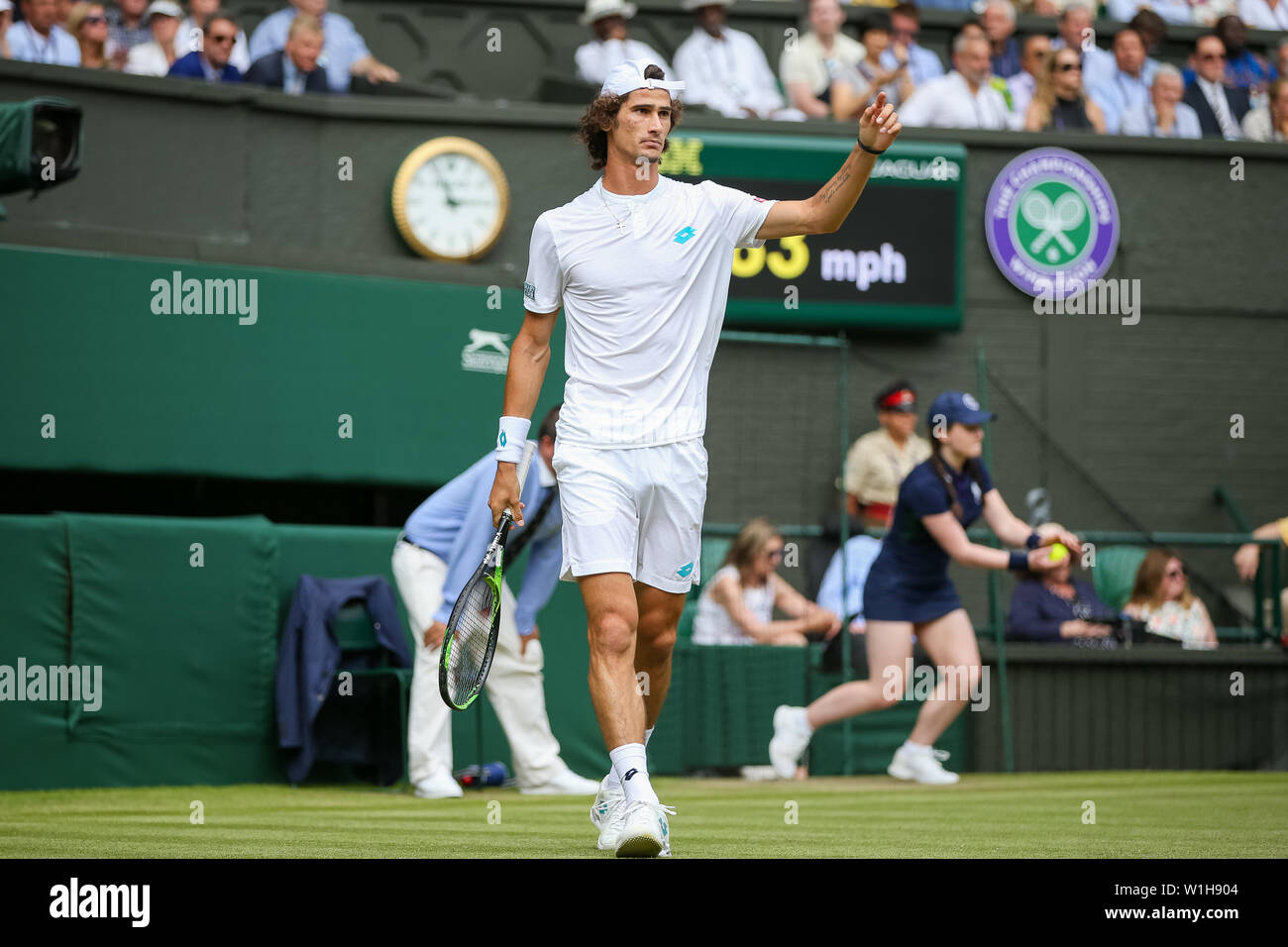Wimbledon, London, UK. 2nd July, 2019. Lloyd Harris of South Africa during  the men's singles first round match of the Wimbledon Lawn Tennis  Championships against Roger Federer of Switzerland at the All