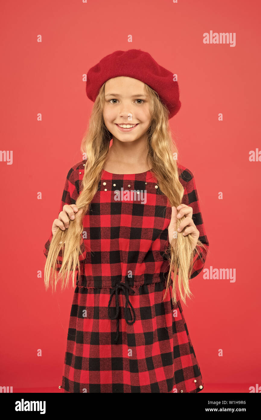 long blonde hair posing in beret hat 
