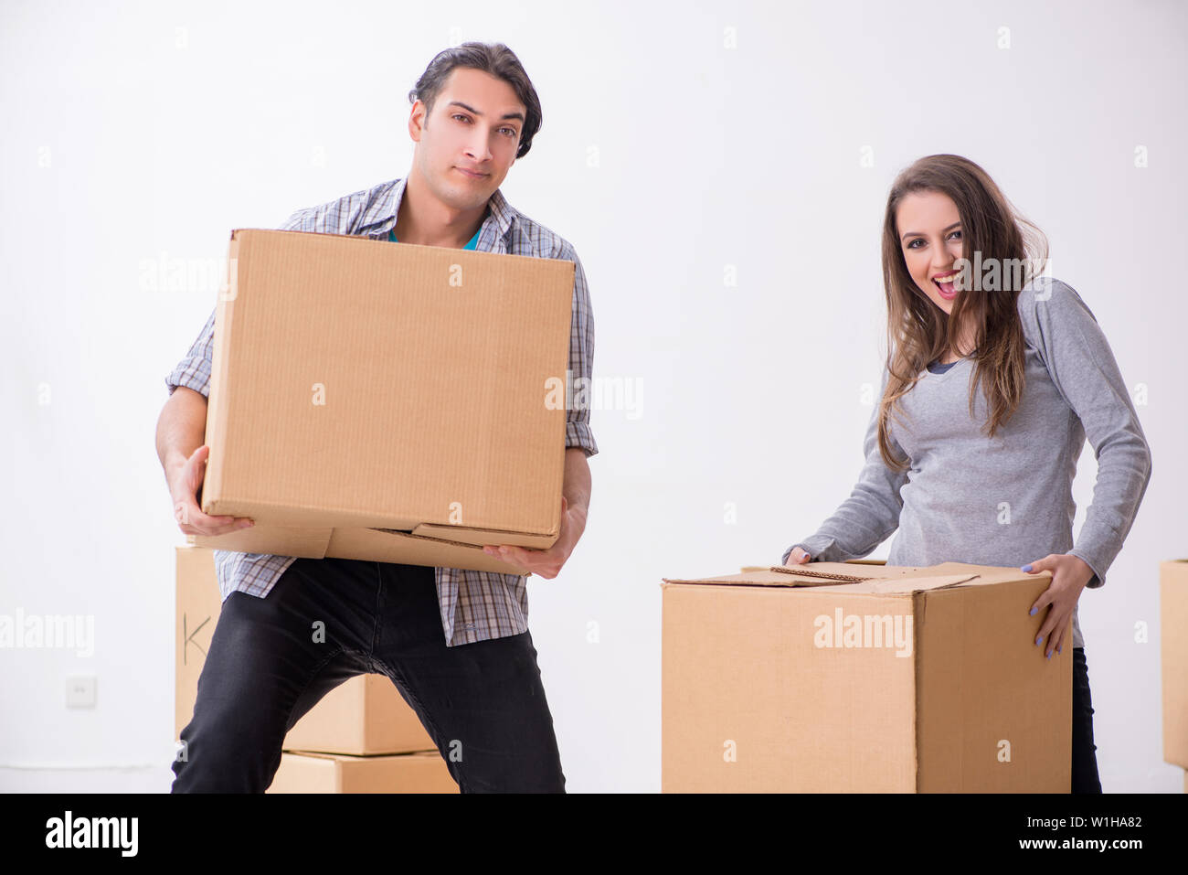 The young pair moving to new flat Stock Photo - Alamy