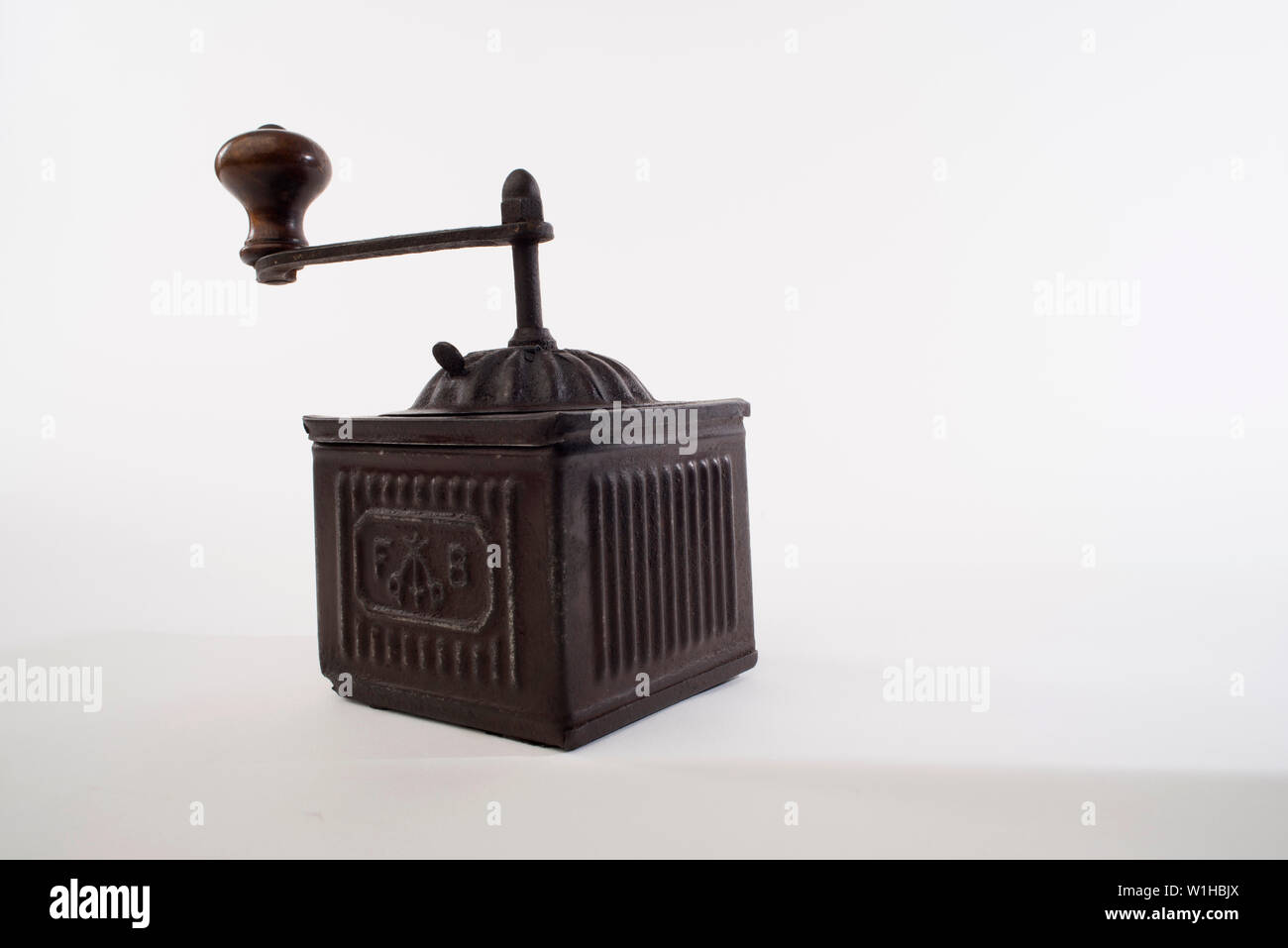 Pepper grinder, Vintage brass pepper mill isolated on white background