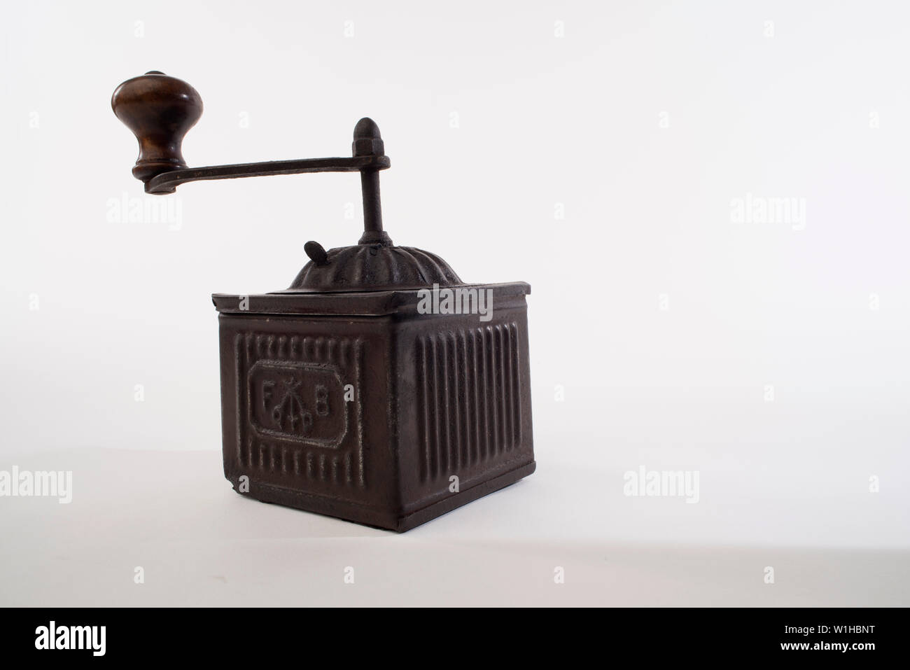 Pepper grinder, Vintage brass pepper mill isolated on white background