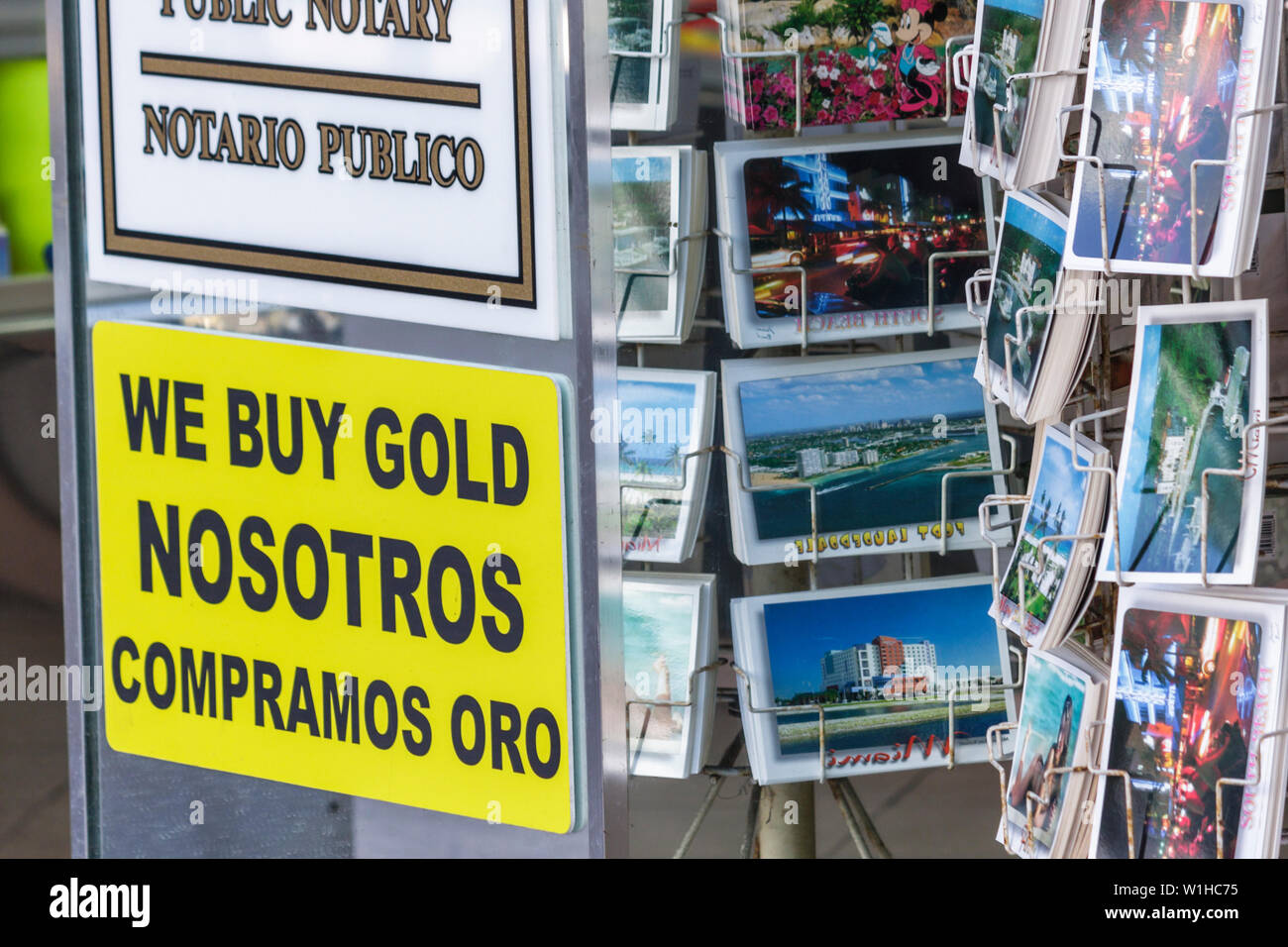 Miami Beach Florida,Lincoln Road,bilingual,sign,logo,Spanish,English,language,bilingual,sign,logo,sundries,postcard,buy gold,small business,visitors t Stock Photo
