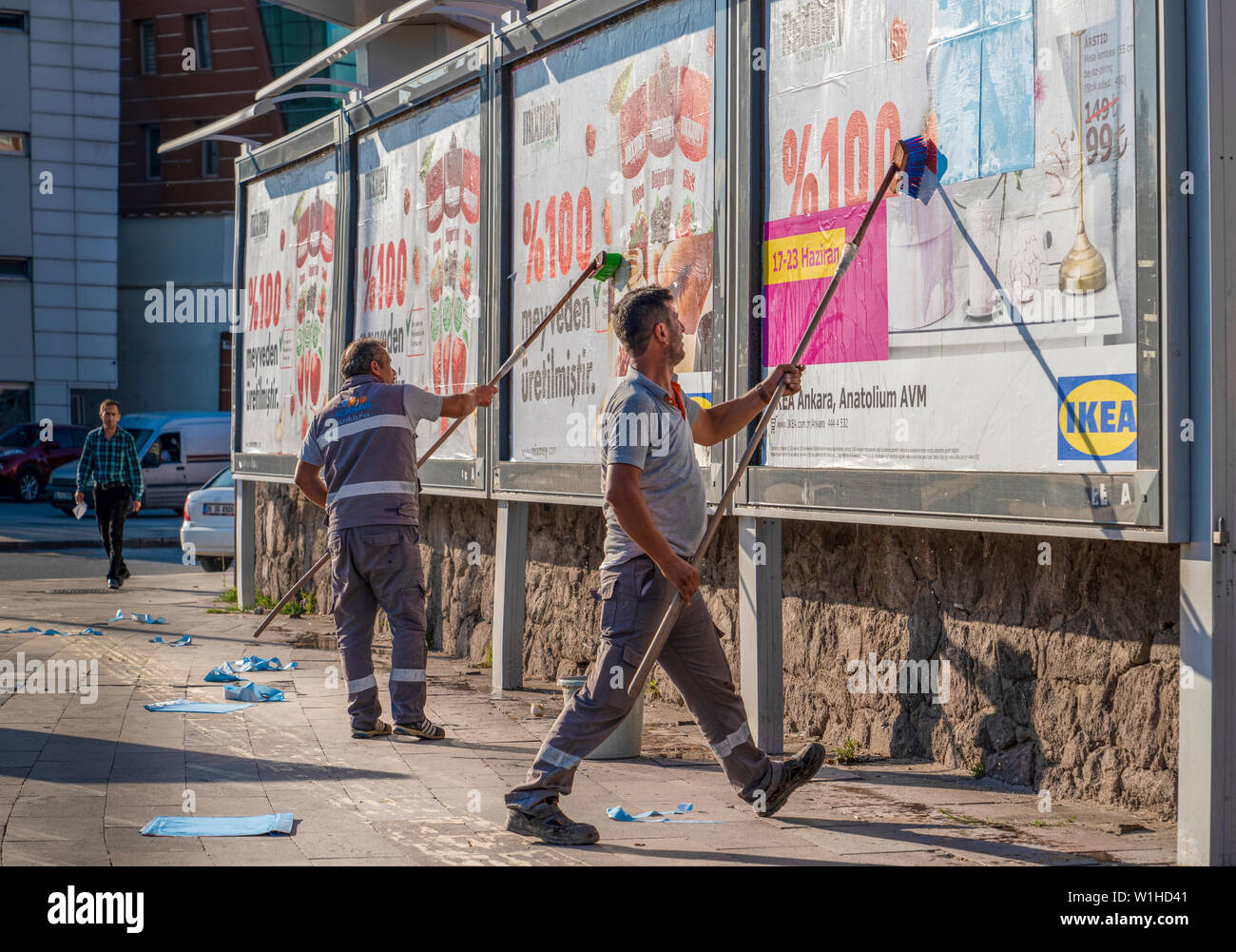 Ankara/Turkey-June 23 2019: Workers remove and install advertising on a billboard. Stock Photo