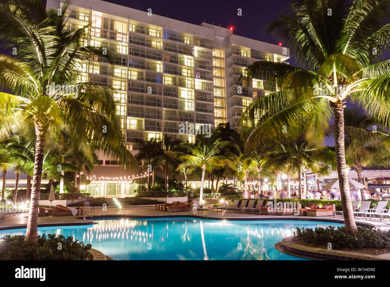 Fort Ft. Lauderdale Florida,Hilton Fort Lauderdale Marina,hotel,hotels,chain,hospitality,lodging,pool,tropical,lighted palm tree,evening,bar lounge pu Stock Photo