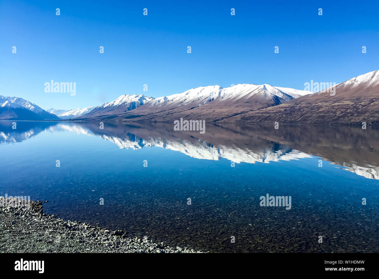 Stunning mirror reflections at the deserted Lake Ohau Stock Photo - Alamy