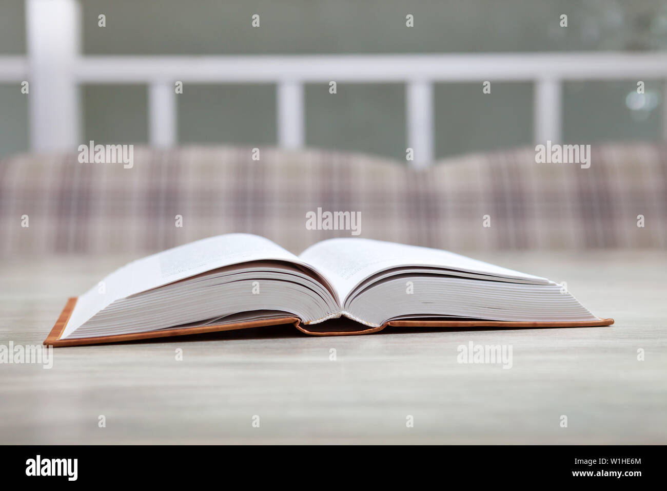 Open book on white table, education concept Stock Photo