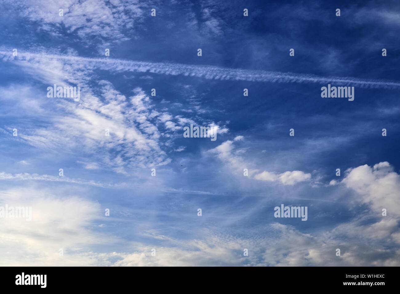 Airplane flying on deep blue hi-res stock photography and images - Alamy