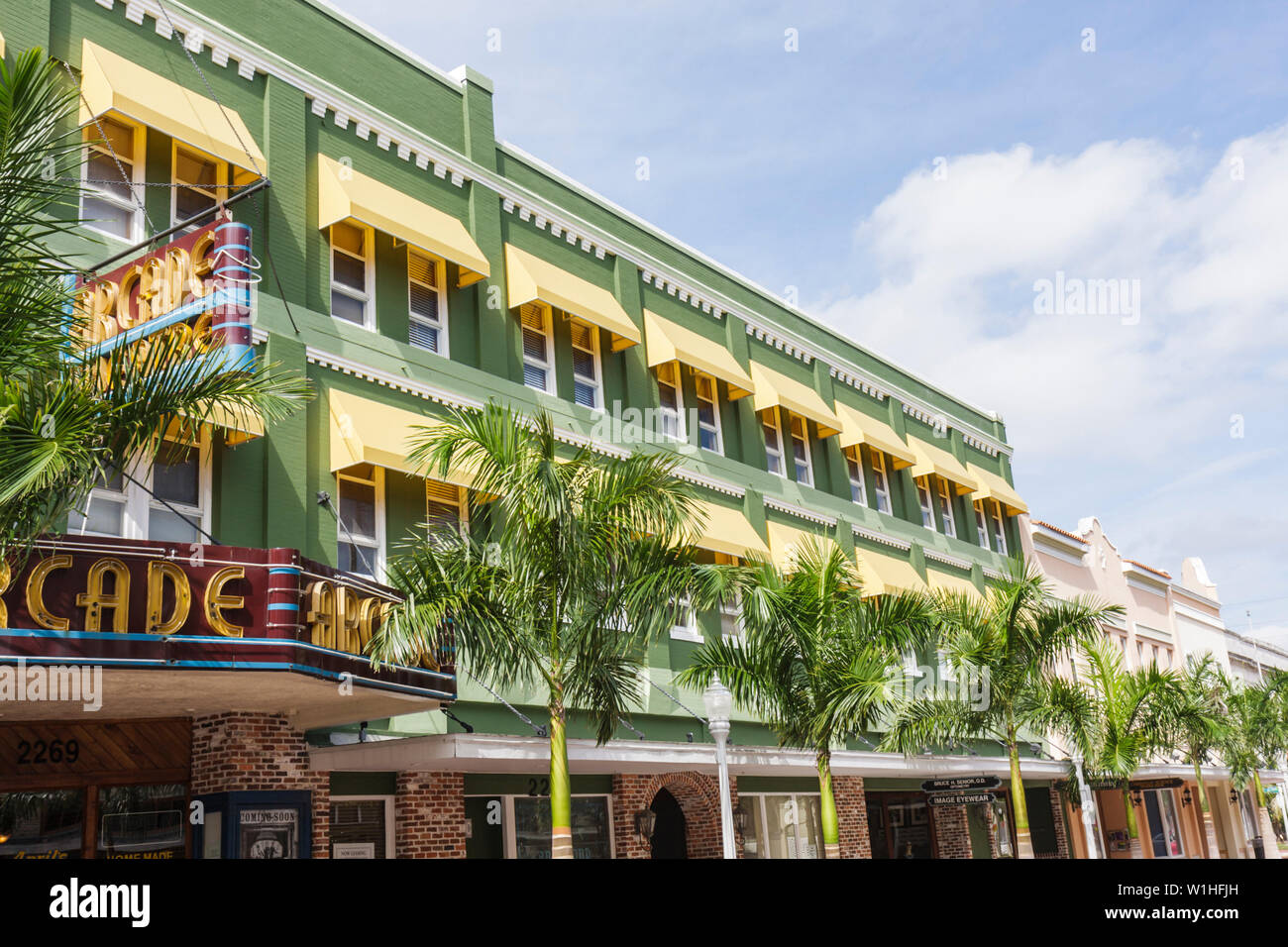 Fort Ft. Myers Florida,River District,First 1st Street,Arcade Theatre,historic building,preservation,restored,renovated,window,awning,yellow,marquee,F Stock Photo