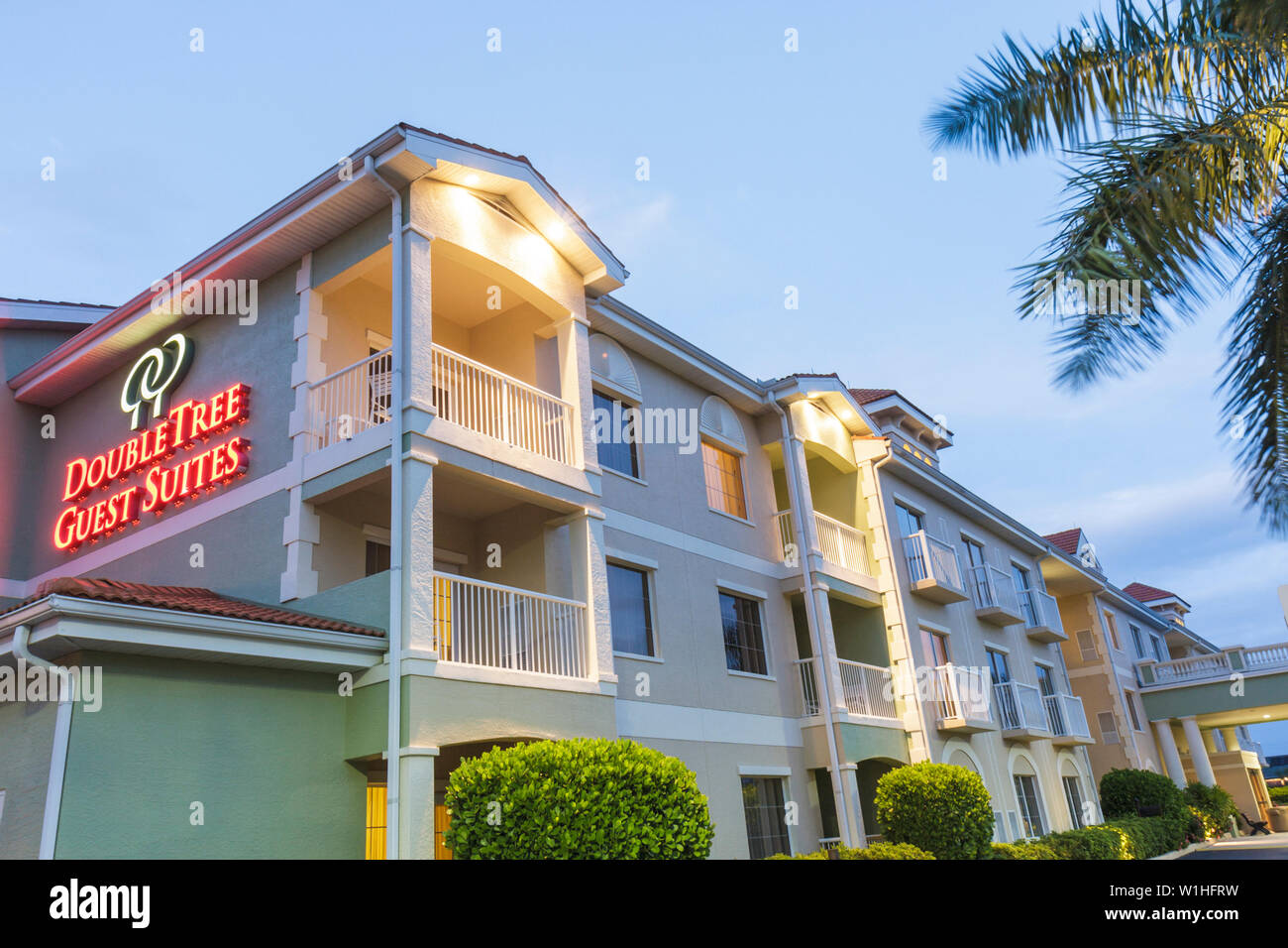 Naples Florida,Hilton DoubleTree Guest Suites,chain,hotel,lodging,dusk,evening,sign,lights,three story building,outside exterior,front,entrance,night, Stock Photo