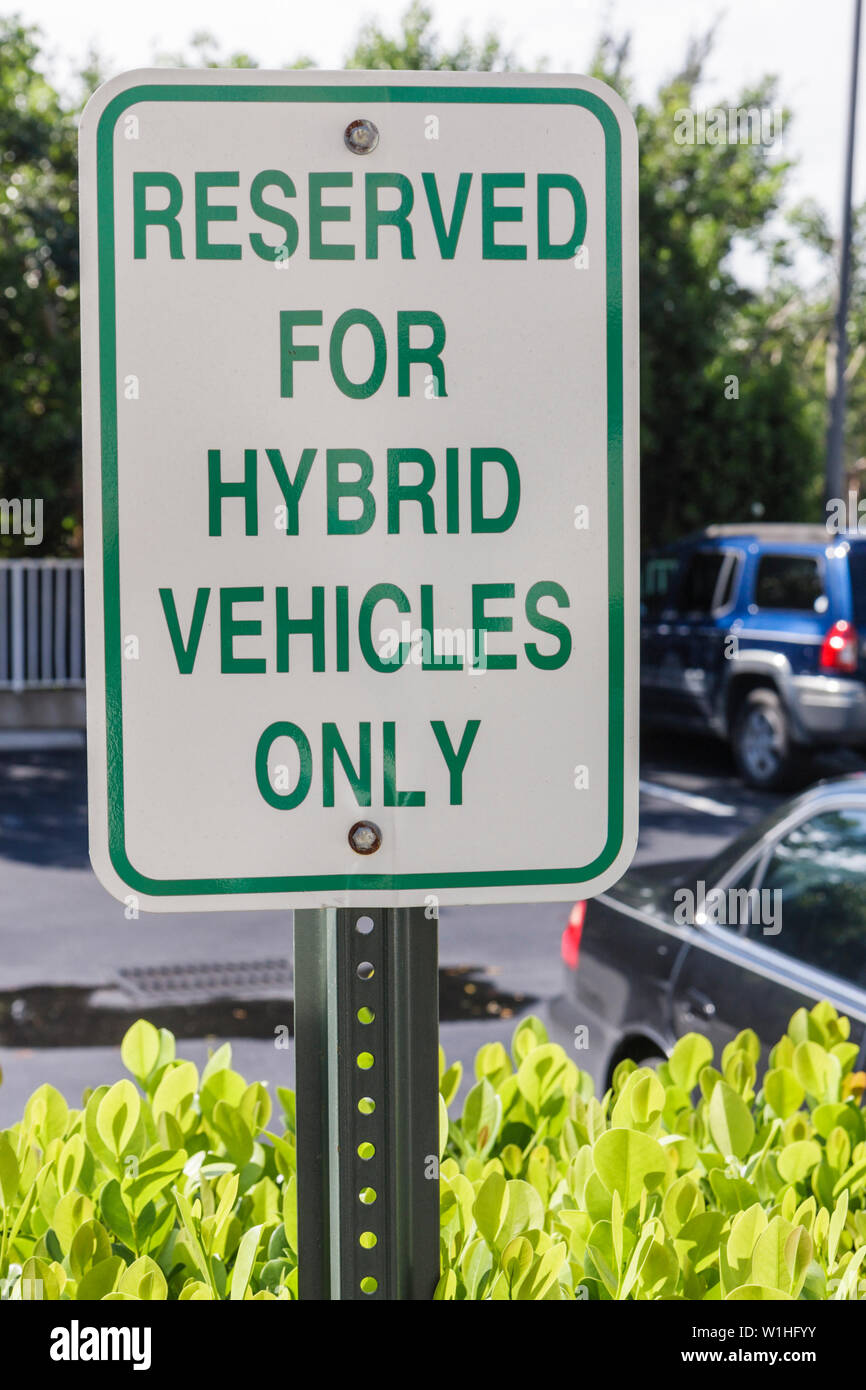 Naples Florida,Hilton DoubleTree Guest Suites,parking lot,sign,reserved space,hybrid vehicles only,Green movement,conservation,FL091018130 Stock Photo