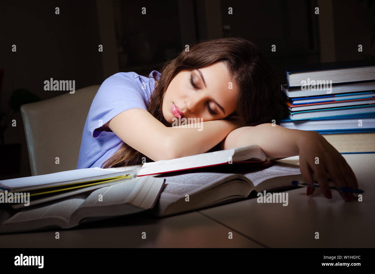 Young female student preparing for exams late at home Stock Photo - Alamy