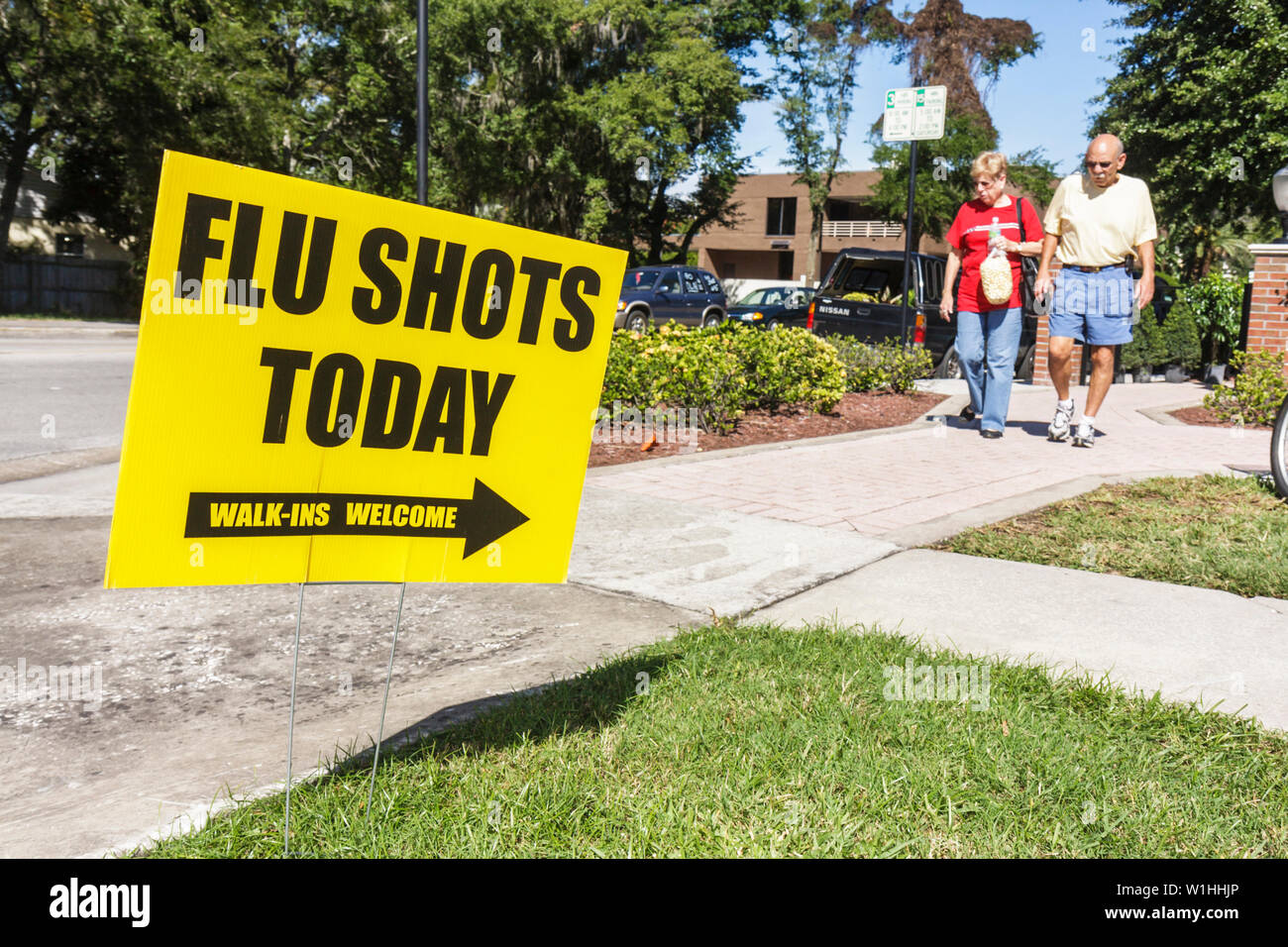 Winter Park Florida,farmers market,sign,flu shots,vaccine,virus,infection,health,pandemic,prevention,man men male,woman female women,couple,adult,adul Stock Photo