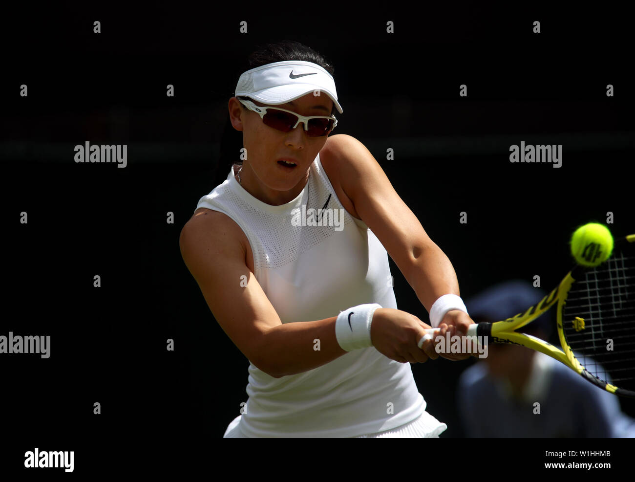 Wimbledon, London, UK. 2nd July 2019. Saisai Zheng of China hits a return to Australia's Ash Barty during their first round match at Wimbledon today.  Barty won the match in straight sets. Credit: Adam Stoltman/Alamy Live News Stock Photo