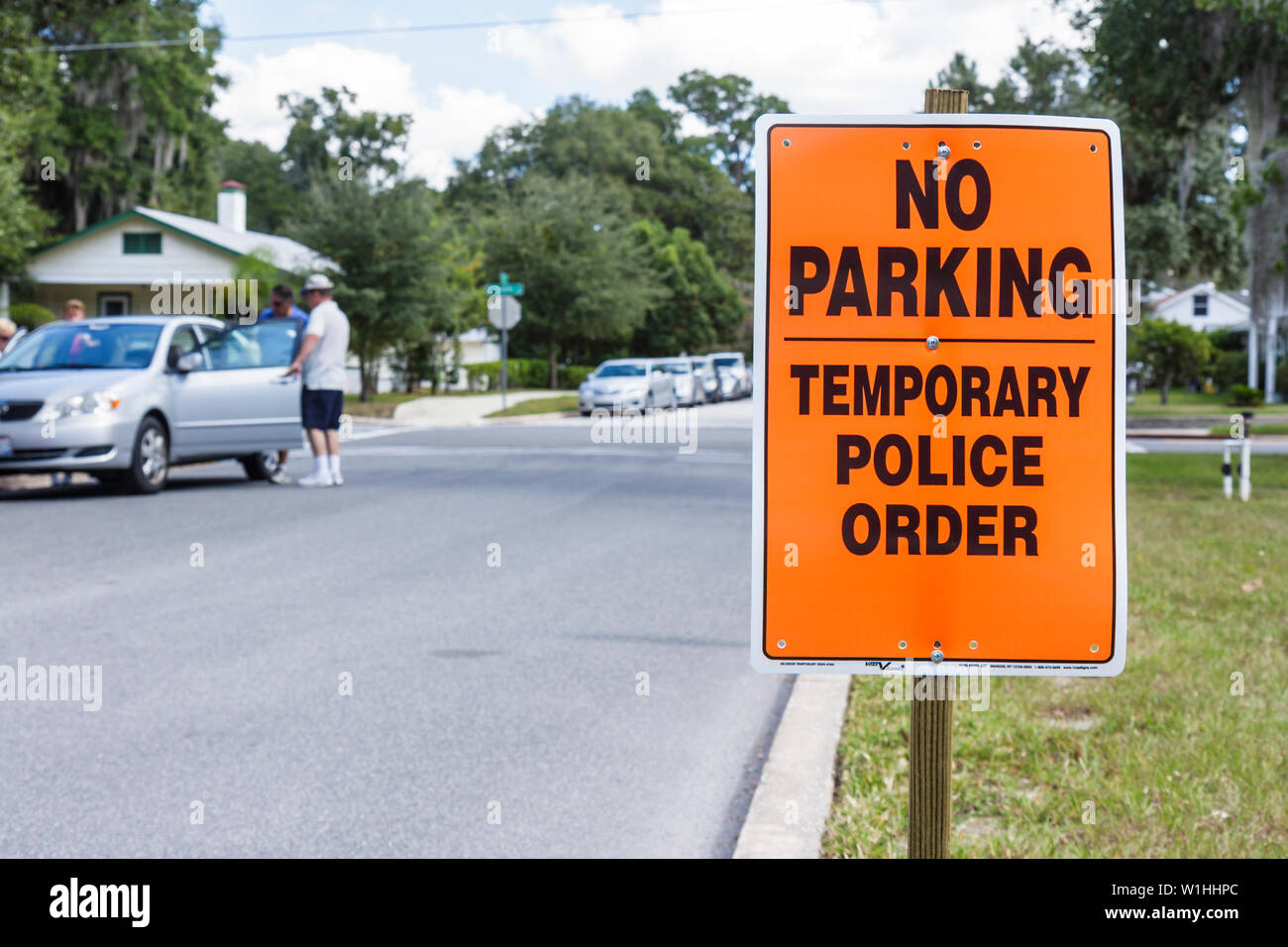 Mt. Mount Dora Florida,Annual Craft Fair,temporary sign,police order,warning,no parking,street,parked car,man men male,FL091025175 Stock Photo