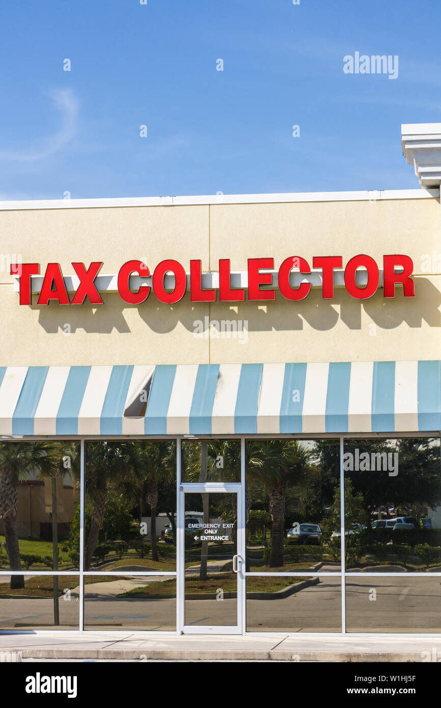 Lake Wales Florida,strip mall,store front,Polk County Tax Collector,awning,sign,government agency,office,vertical,glass reflection,currency,money,FL09 Stock Photo
