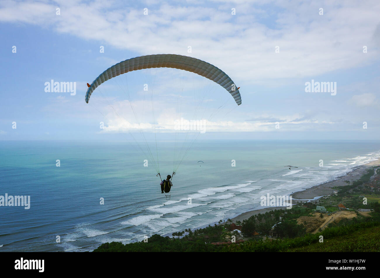 Paragliding over Parangtritis beach, Yogyakarta, Indonesia Stock Photo