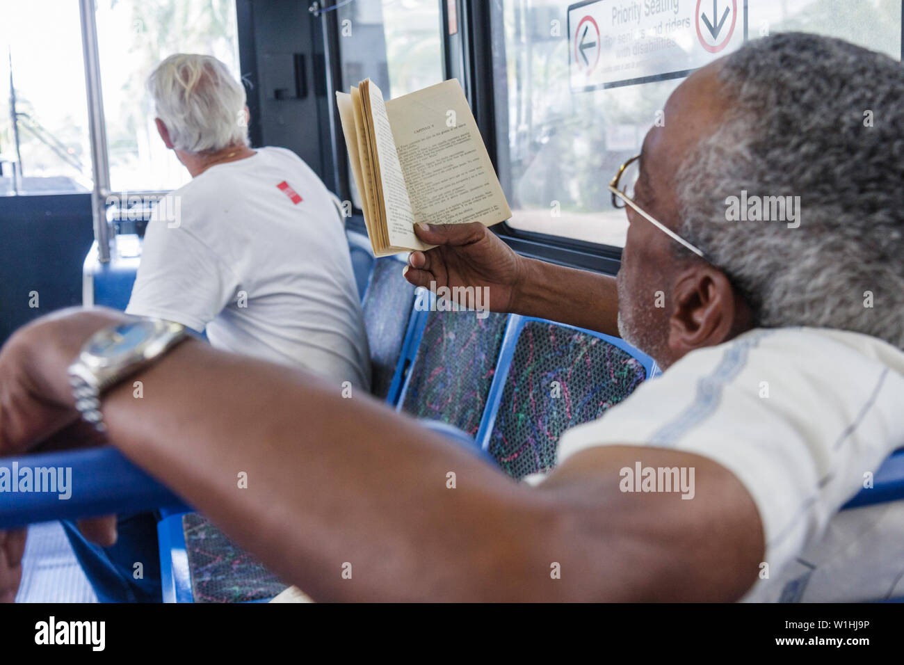 Miami Beach Florida,Metrobus,mass transit,public transportation,passenger passengers rider riders,Black Blacks African Africans ethnic minority,adult Stock Photo