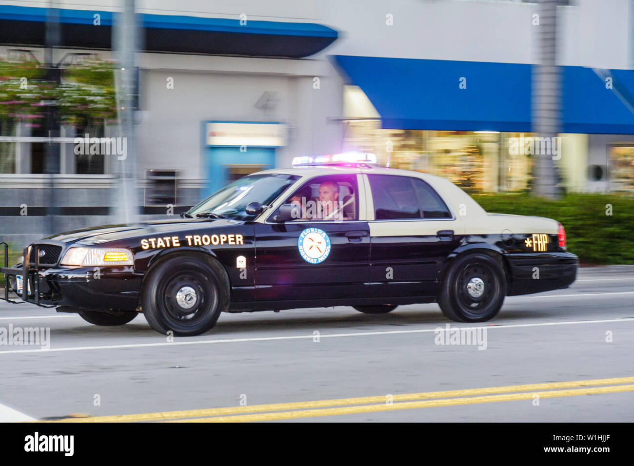 Miami Beach Florida,41st Street,Arthur Godfrey Road,State Trooper,FHP,Florida Highway Patrol,car,vehicle,emergency lights,police,officer,public safety Stock Photo