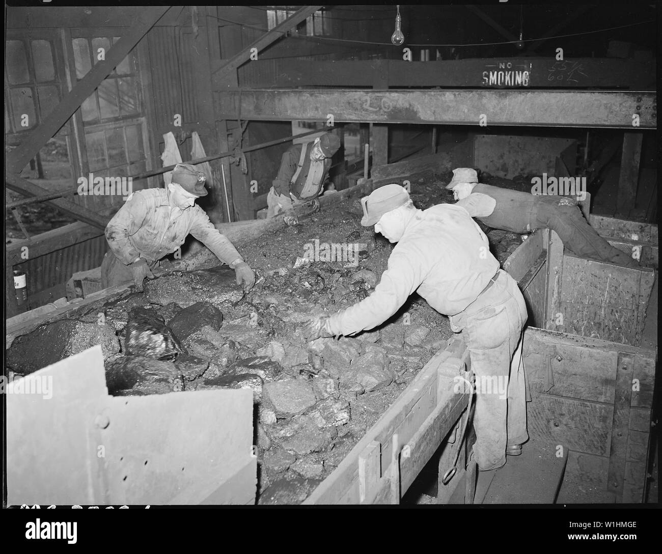 Picking slate from coal being conveyed to breaker plant. The St. Clair