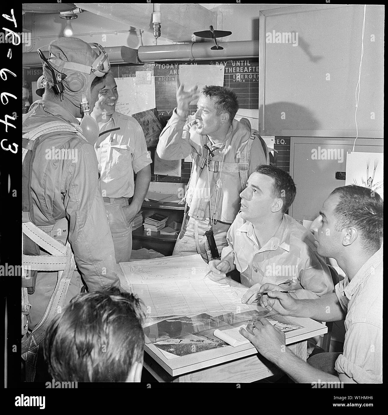 Pilot tells of dive bombing of Wake Island in ready room of USS